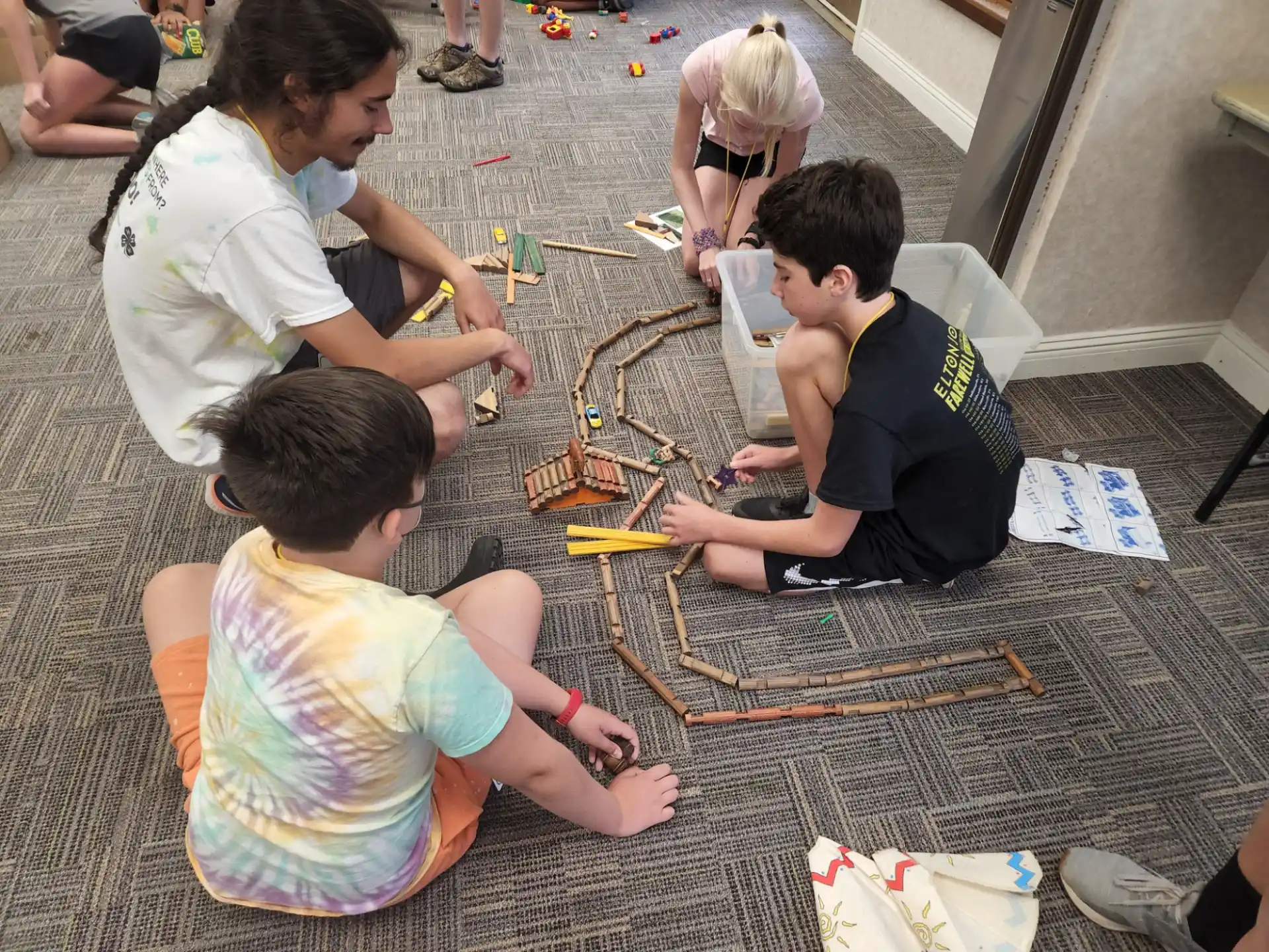a group of people sitting on the ground