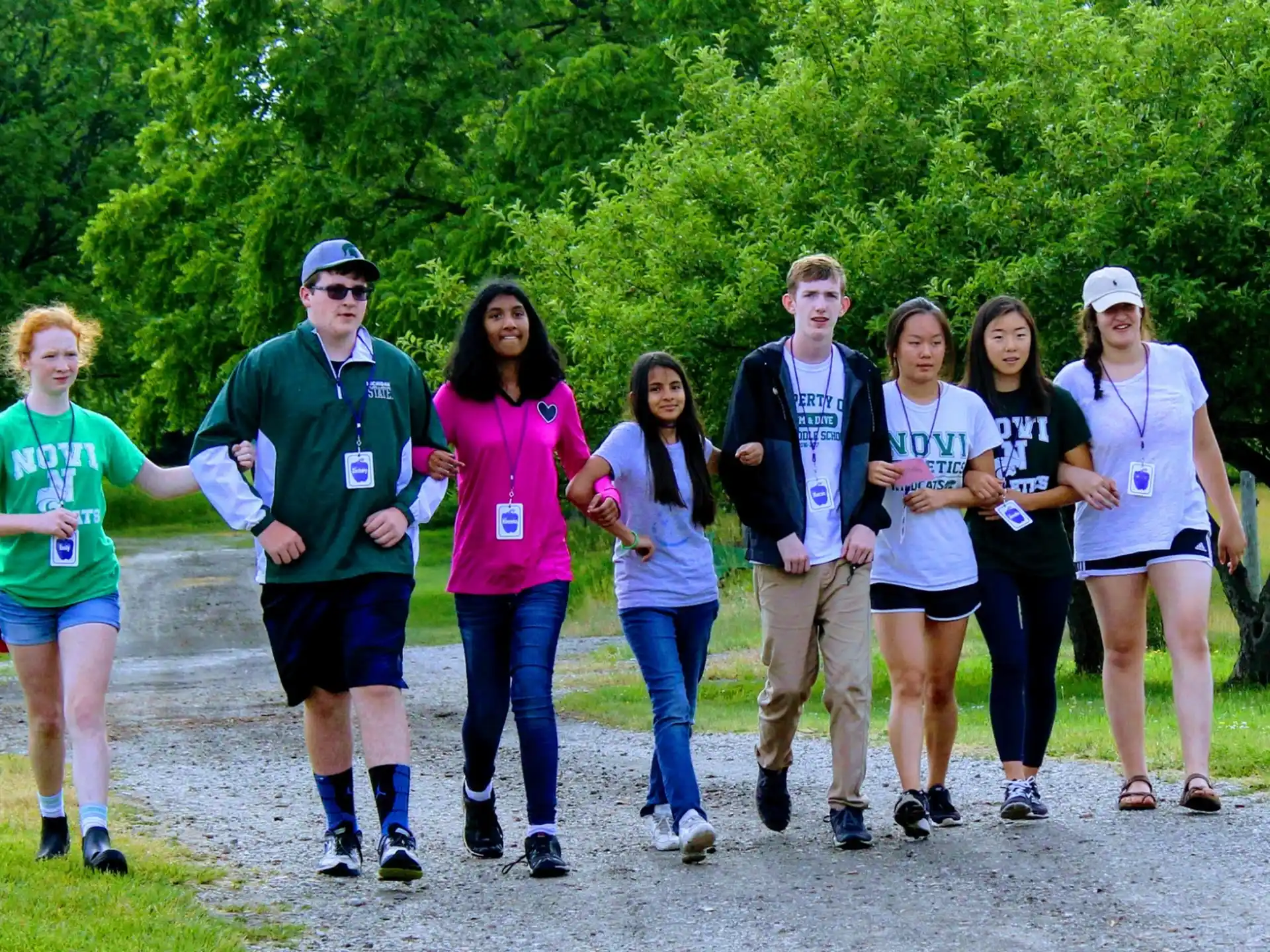 a group of people walking on a path