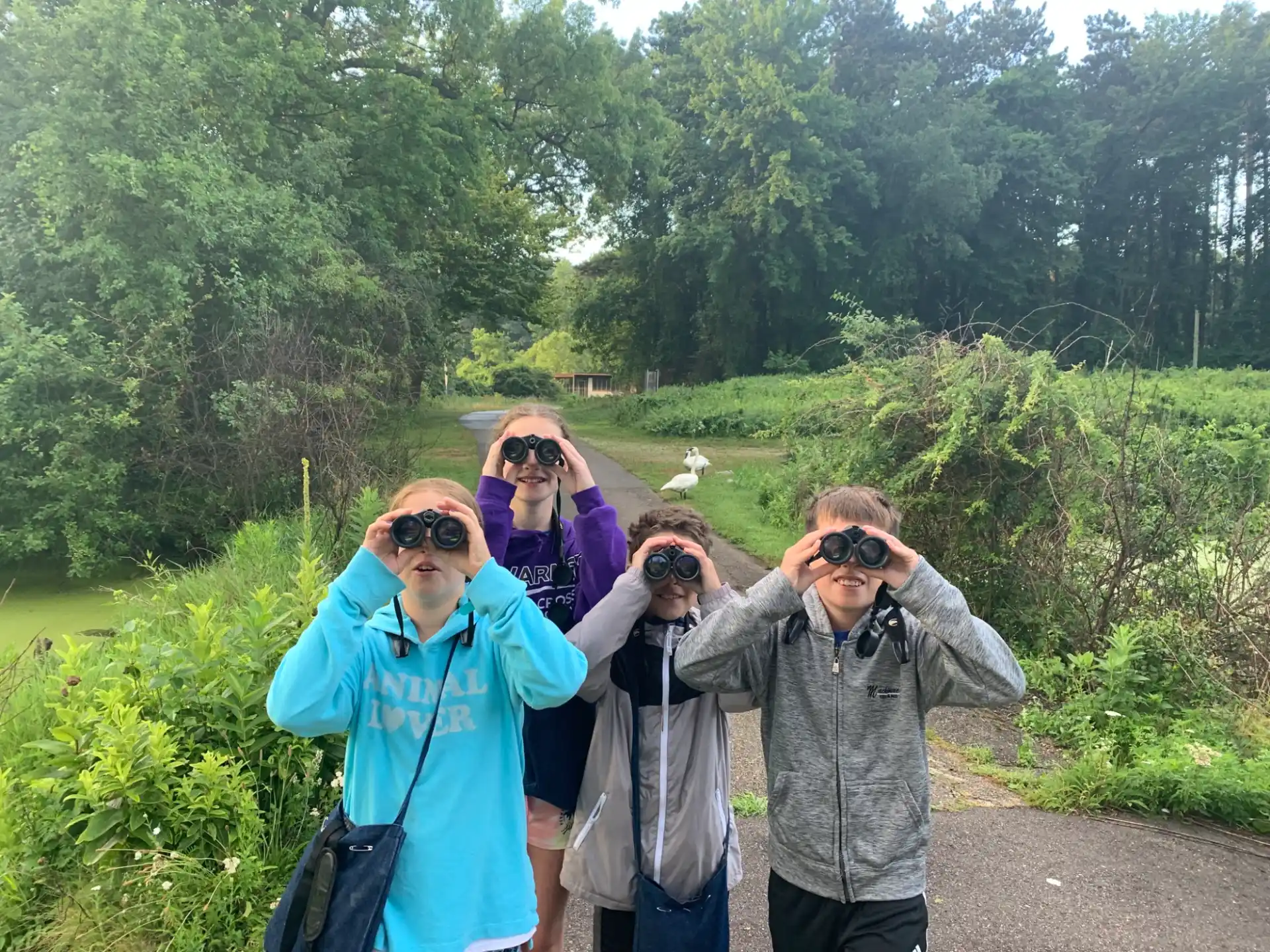 a group of people with binoculars