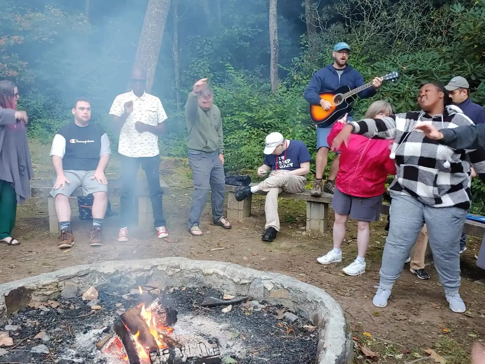 a group of people around a fire