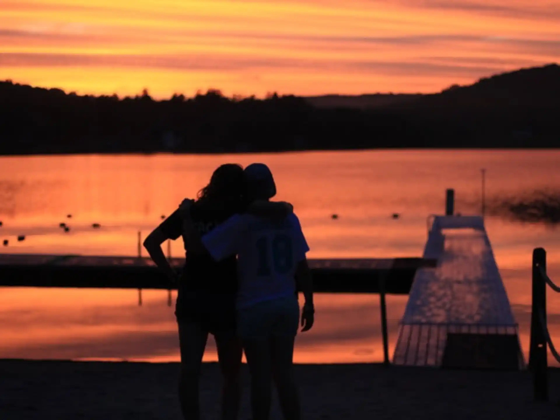 a couple kissing on a beach