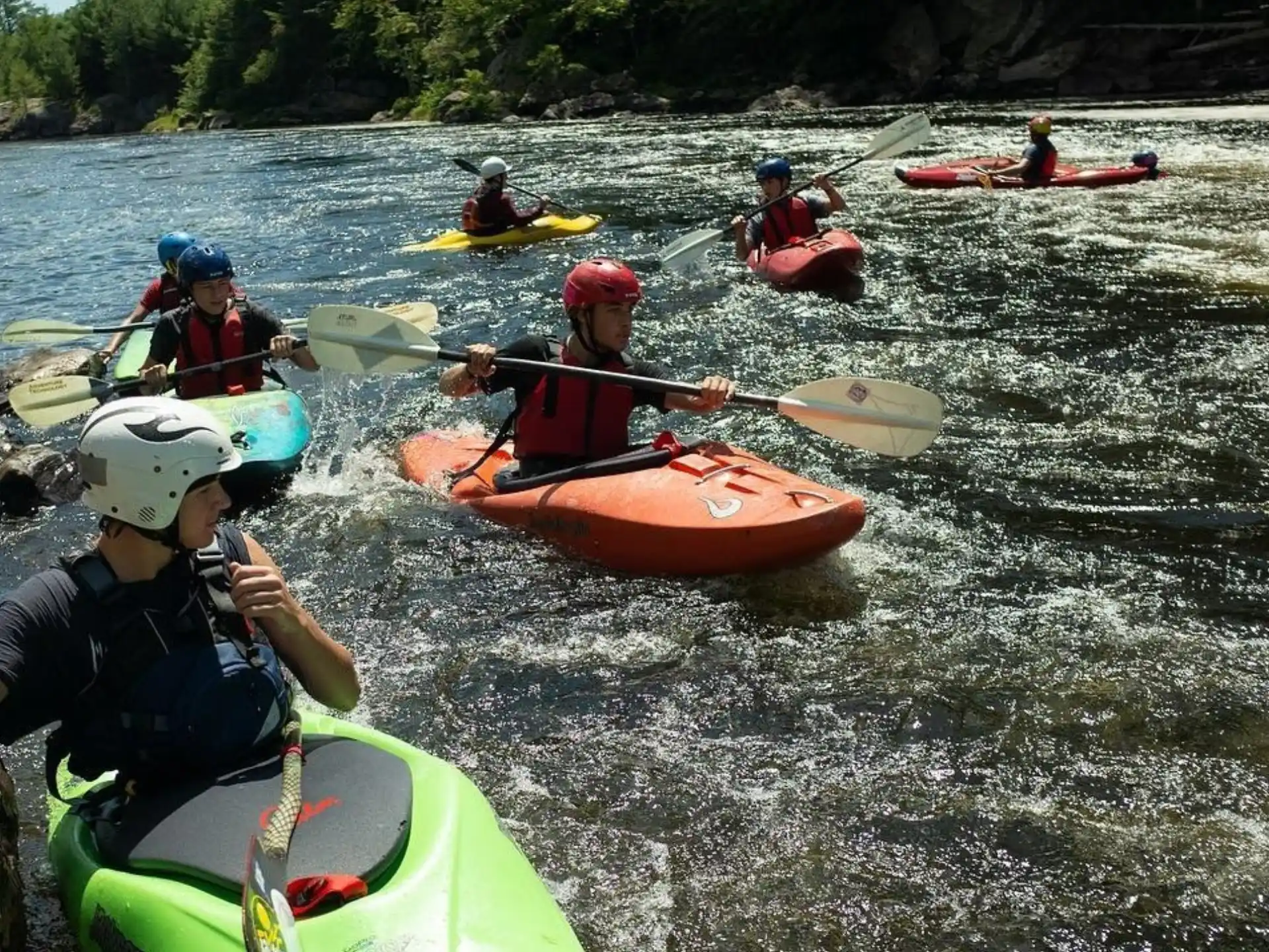 a group of people in kayaks