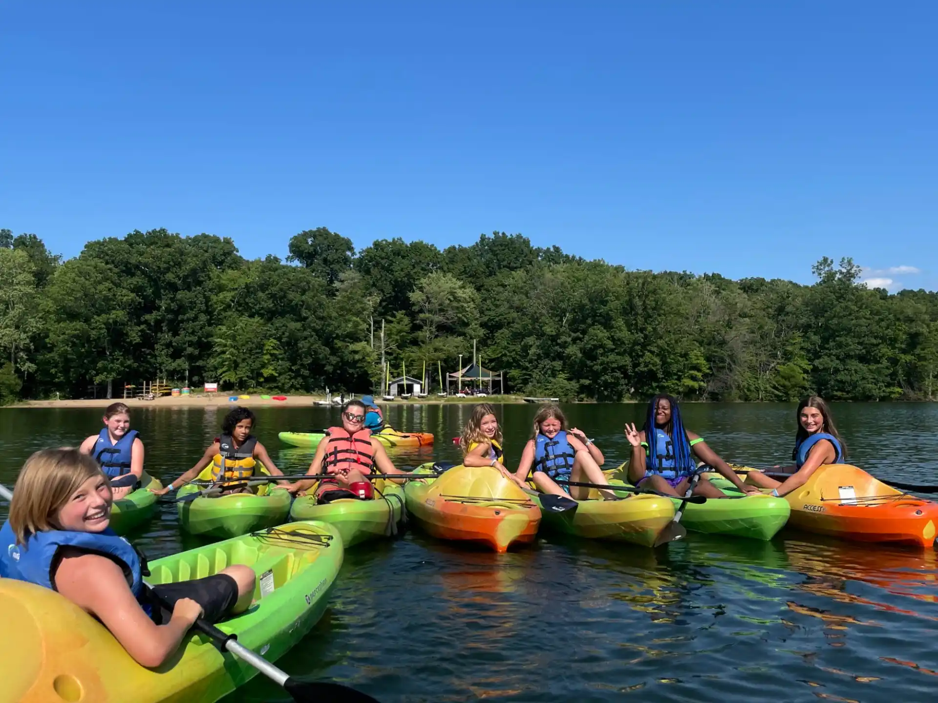 a group of people in canoes on a river