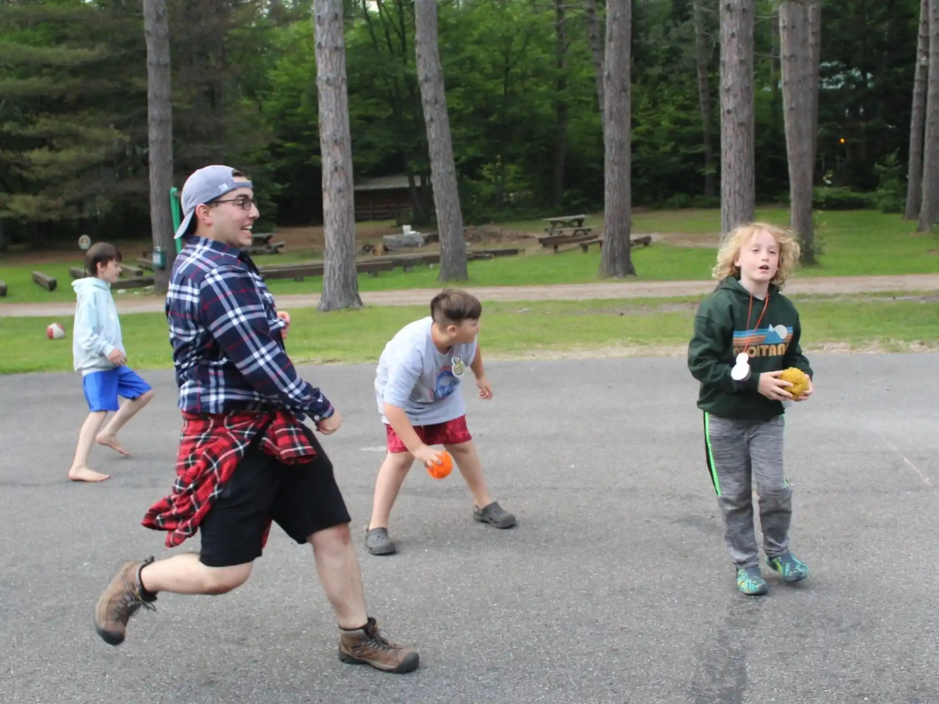 a group of kids playing in a park