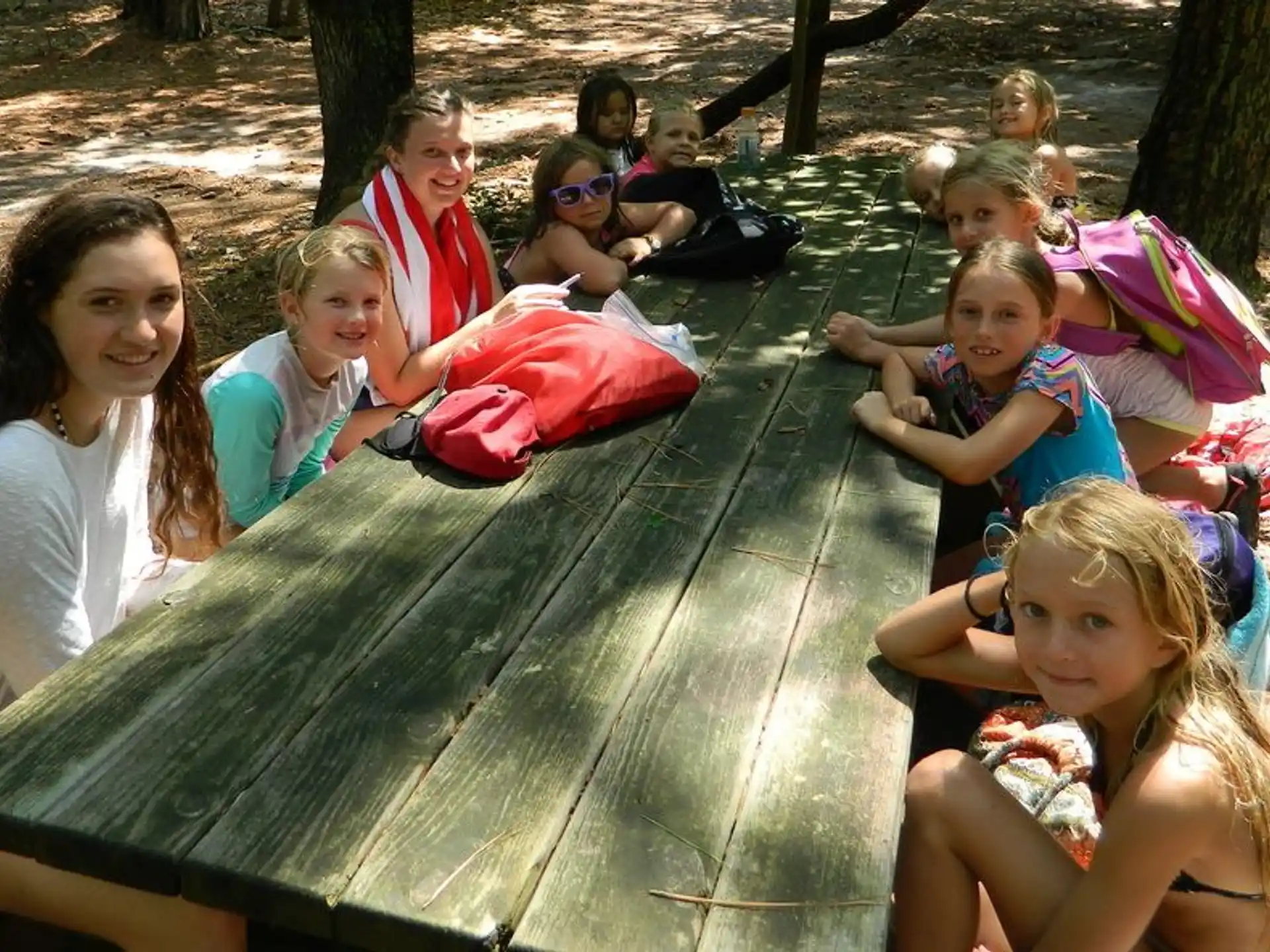 a group of people sitting on a bench