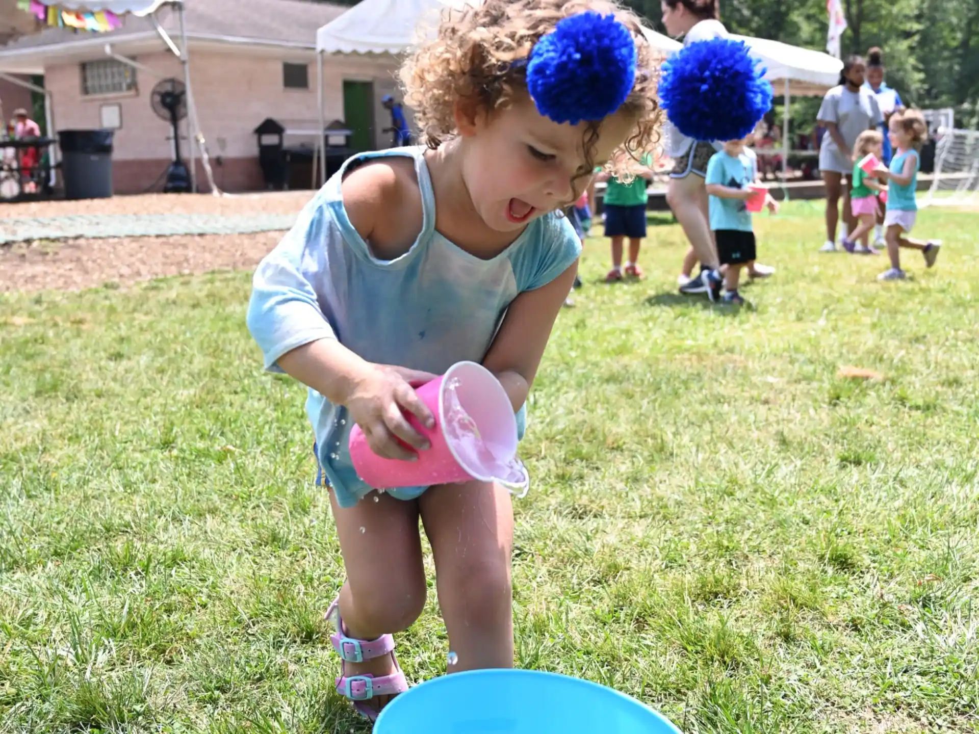 a little girl playing with a frisbee