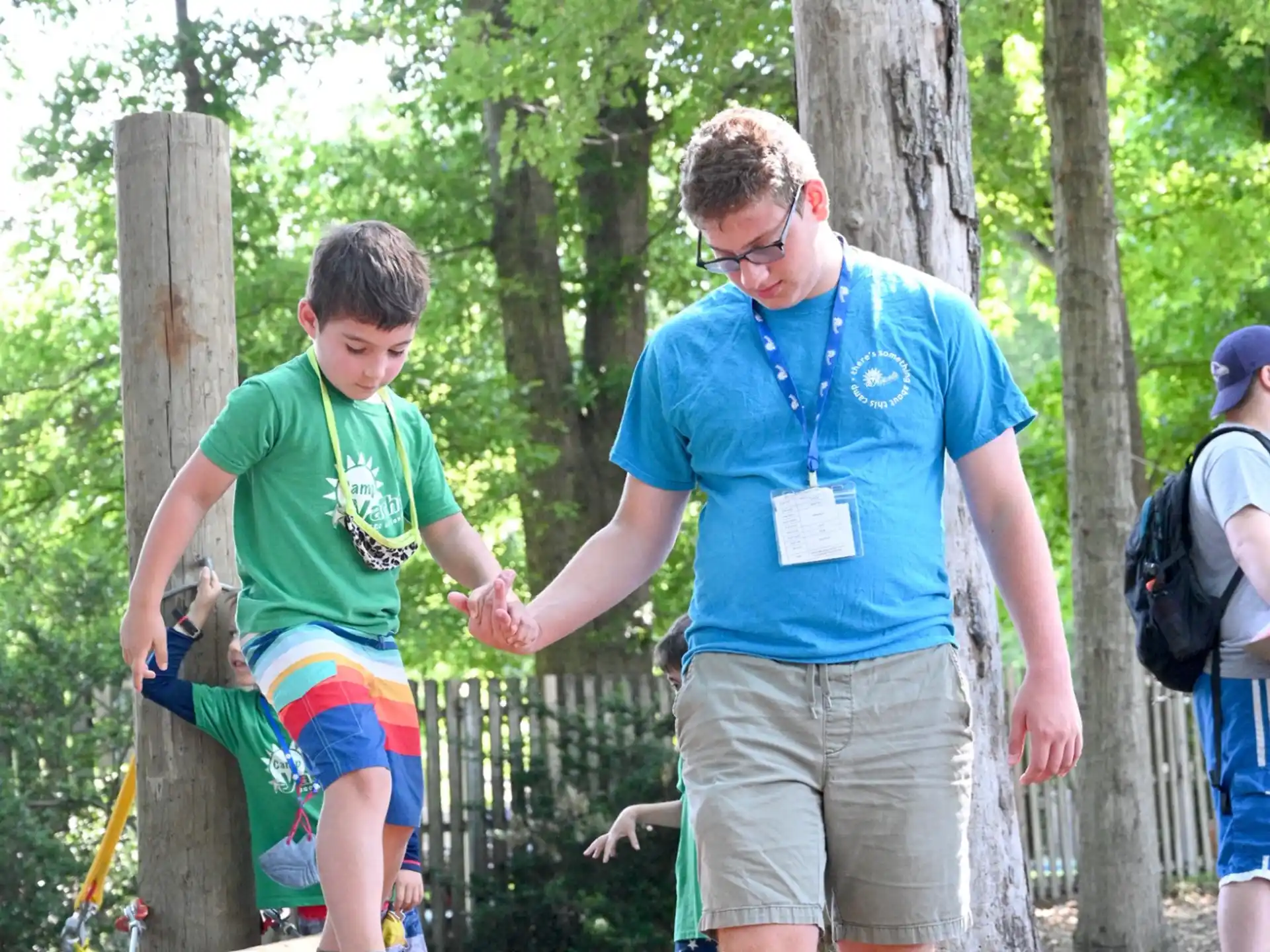 a person and a boy playing with a toy