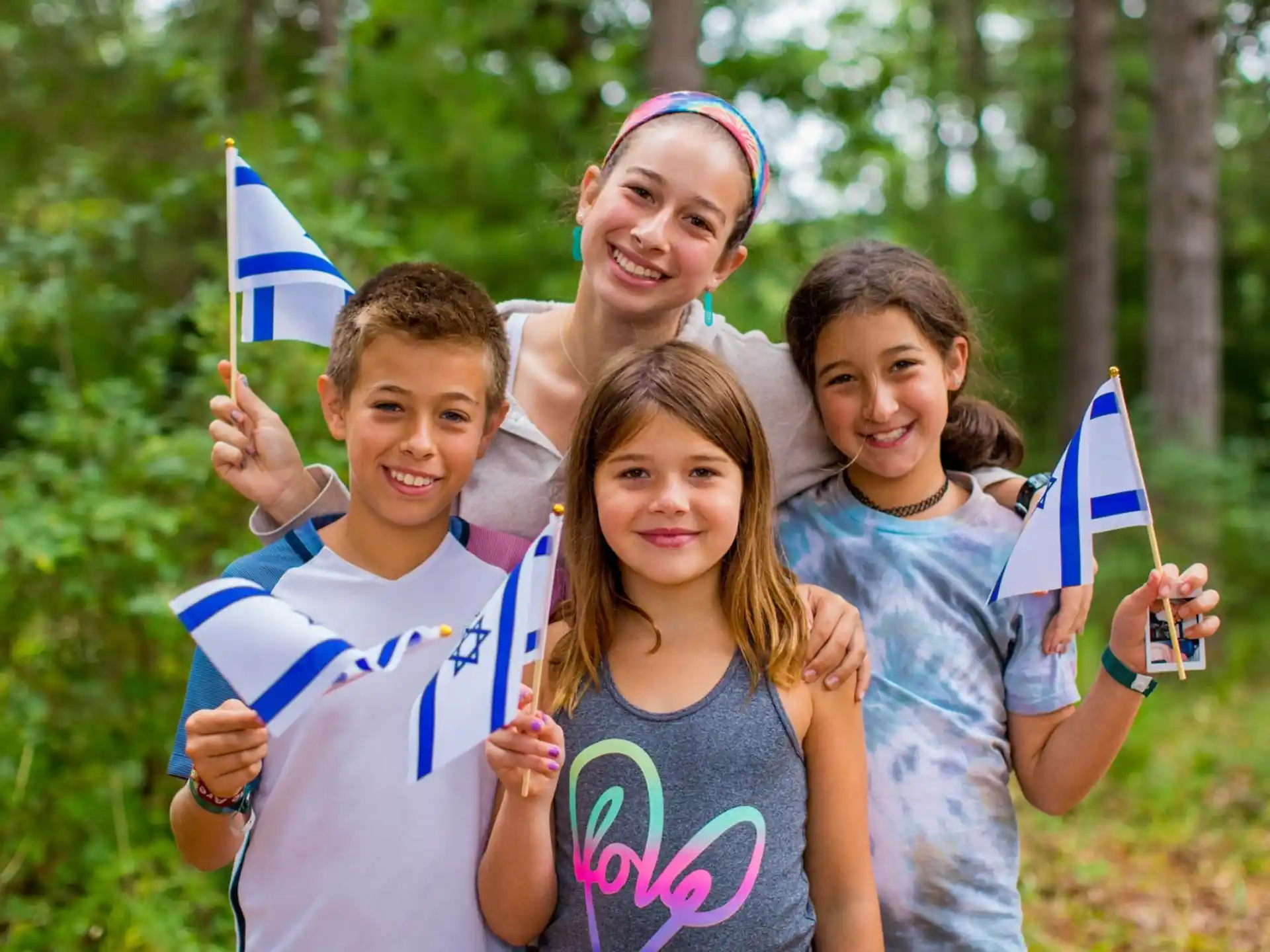 a group of children holding flags