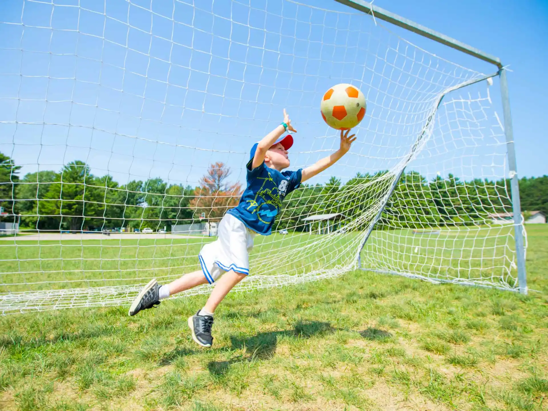 a man jumping to catch a ball