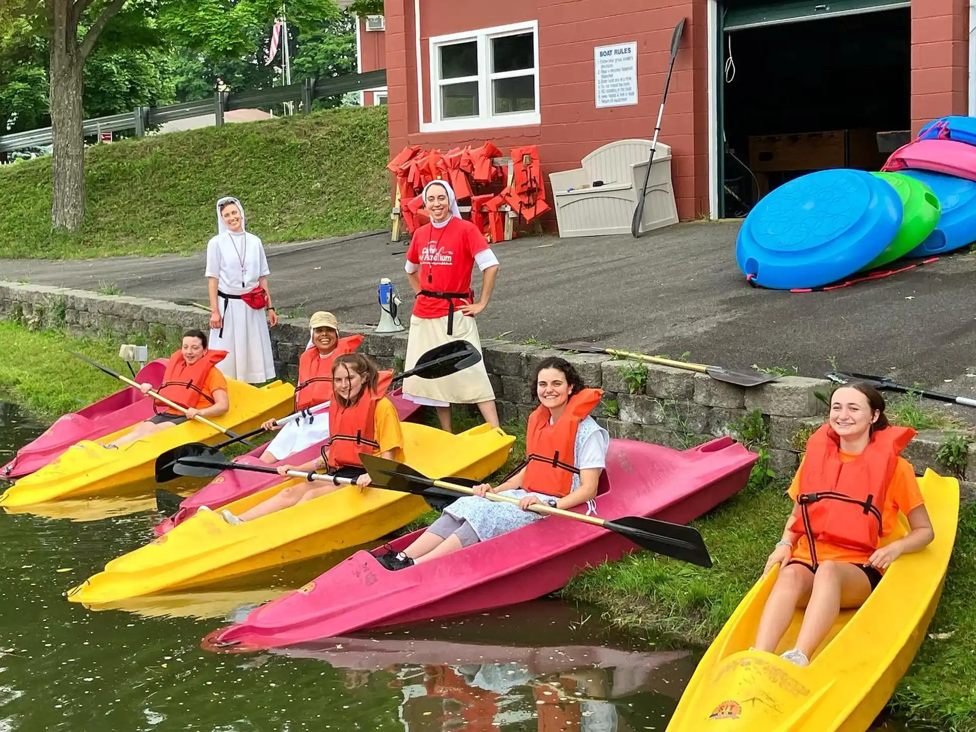 a group of people in kayaks