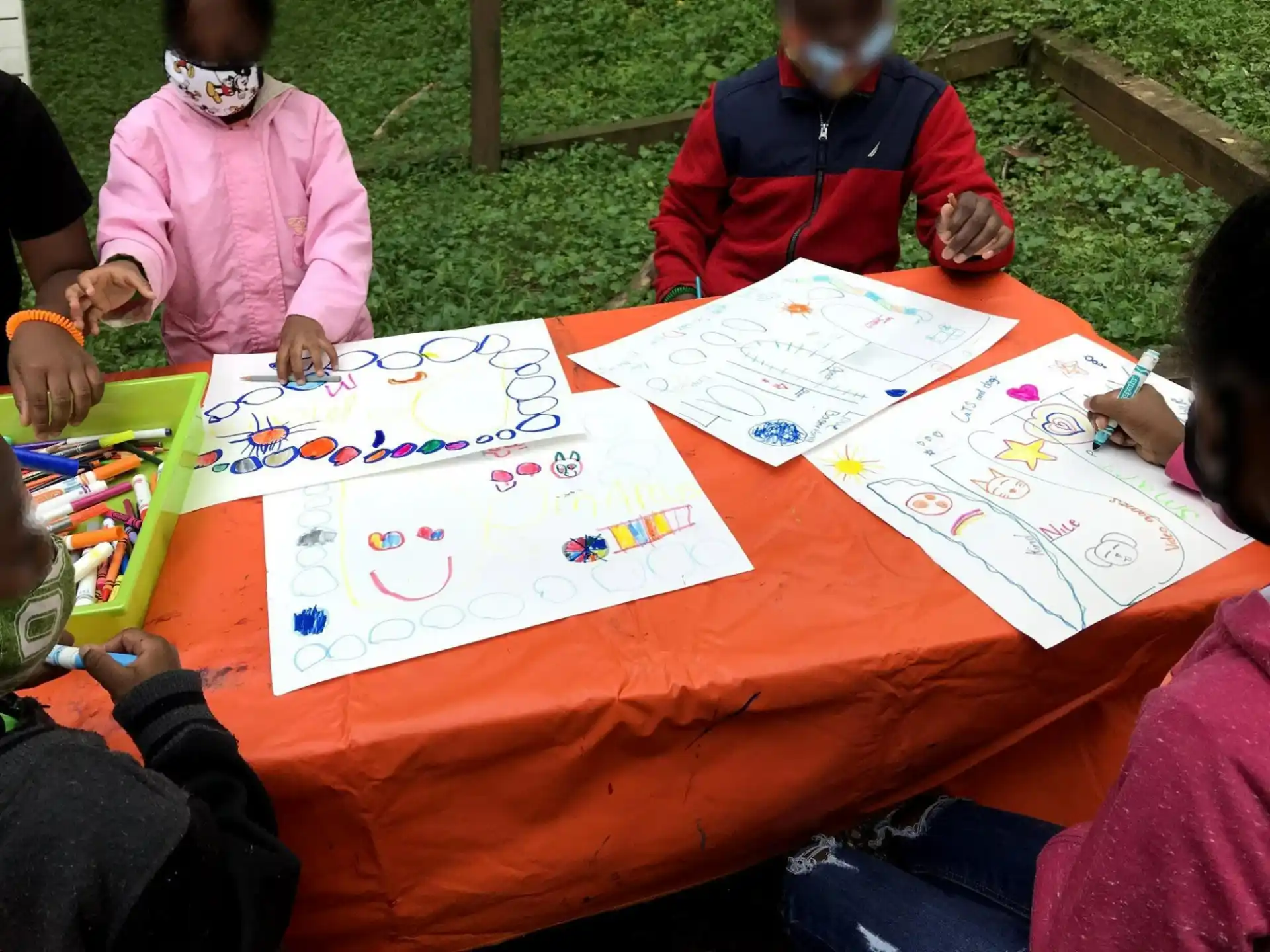 a group of people sitting around a table with a board game