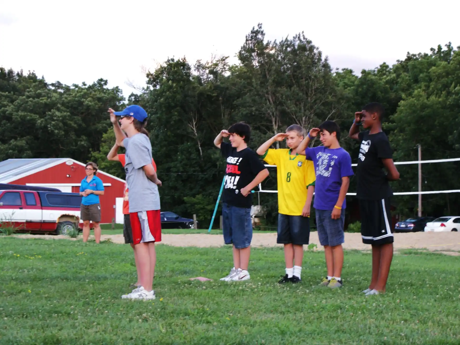 a group of people standing on a field