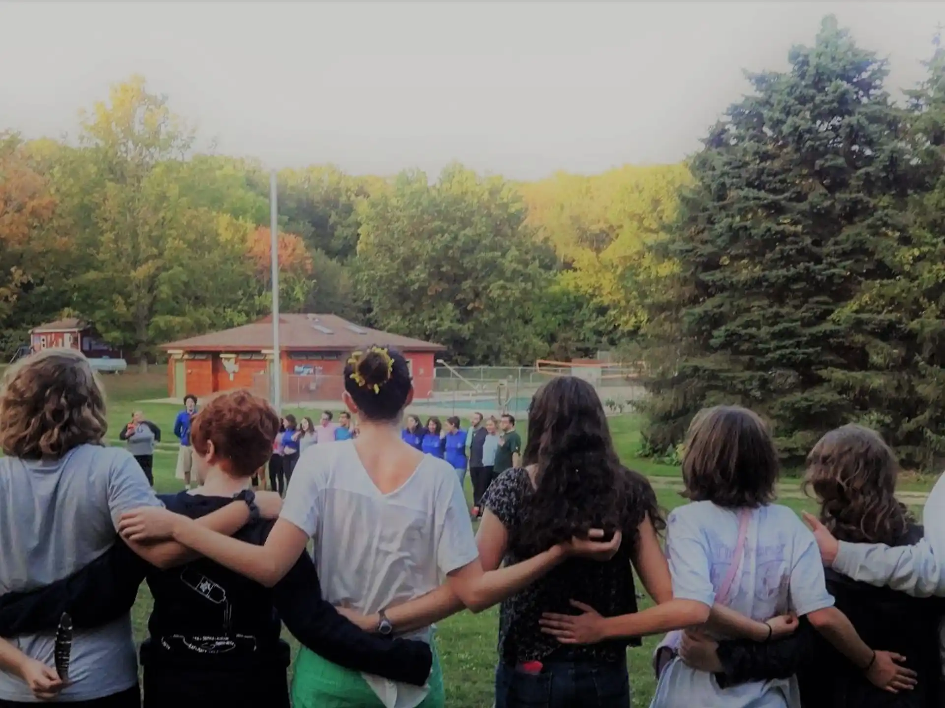 a group of people sitting on the ground