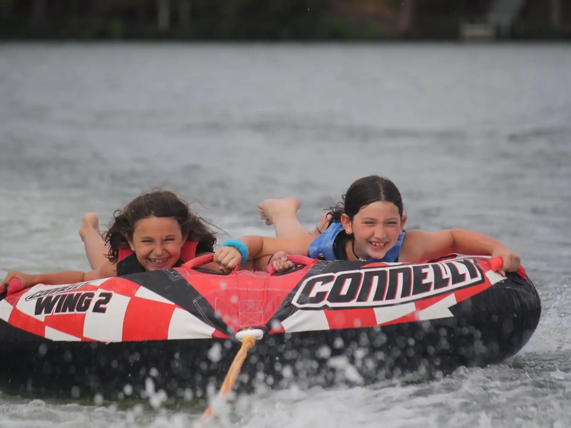 a couple of kids on a raft