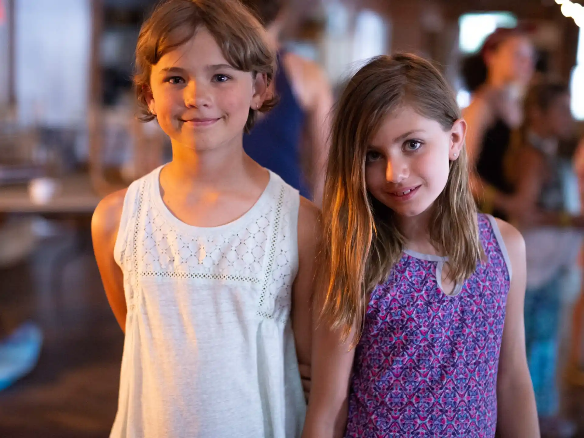 a couple of girls posing for the camera
