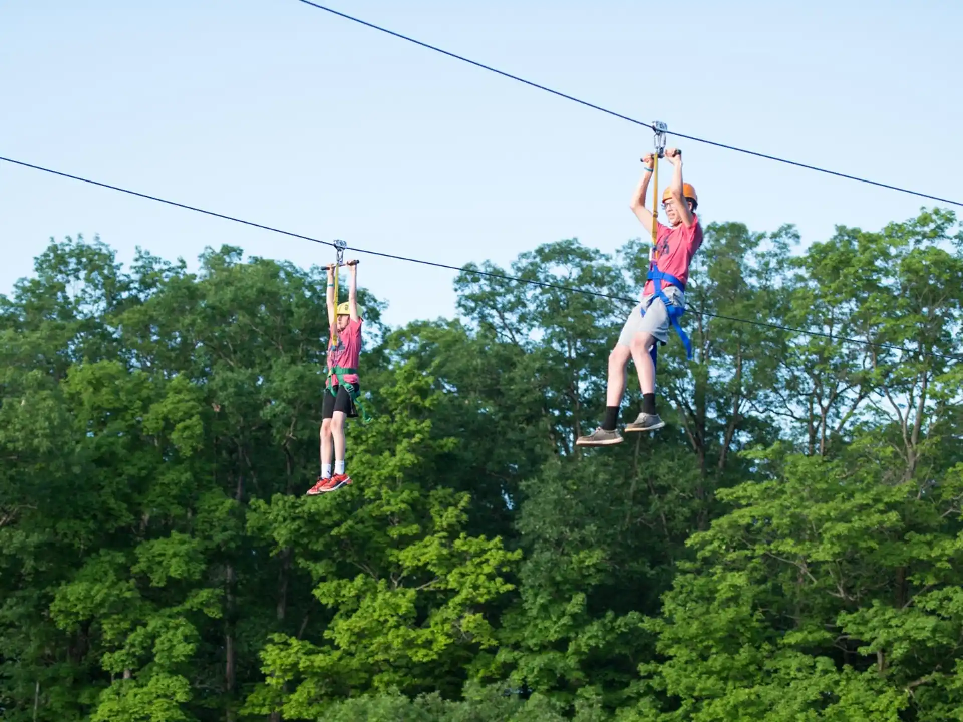 a couple of people on a cable