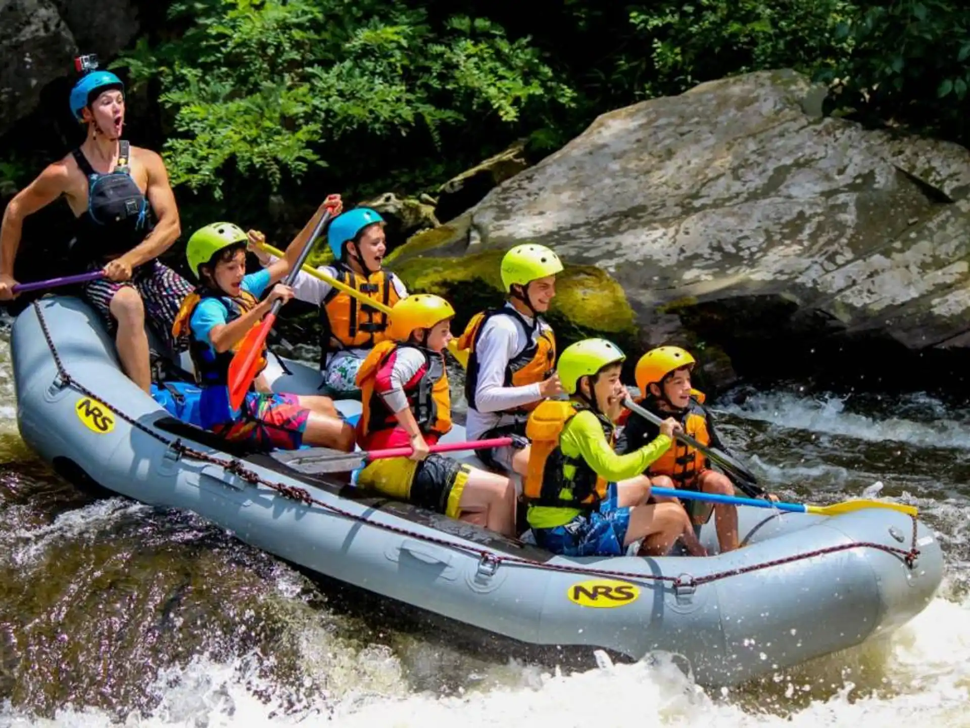 a group of people in a raft