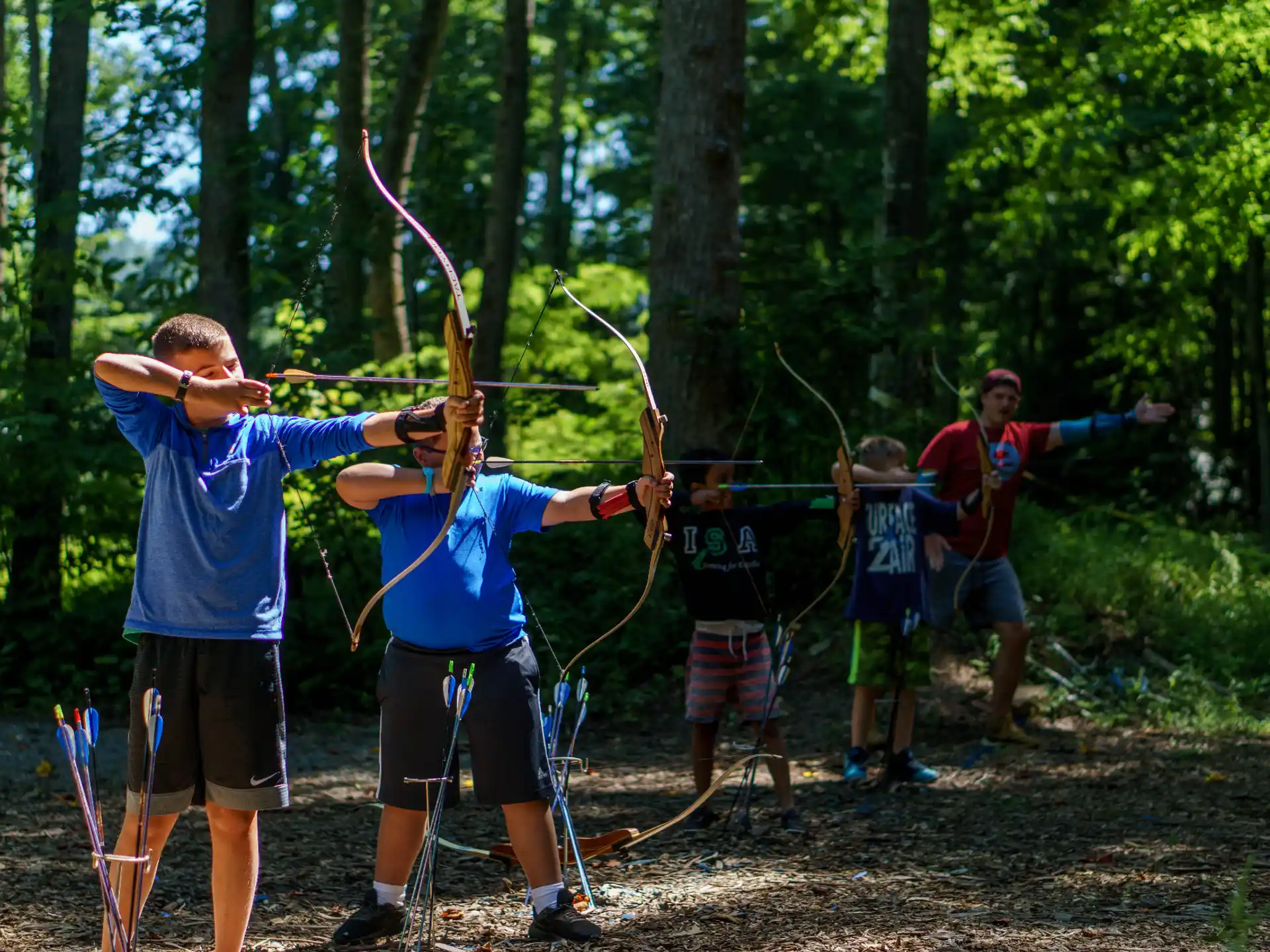a group of people shooting bows