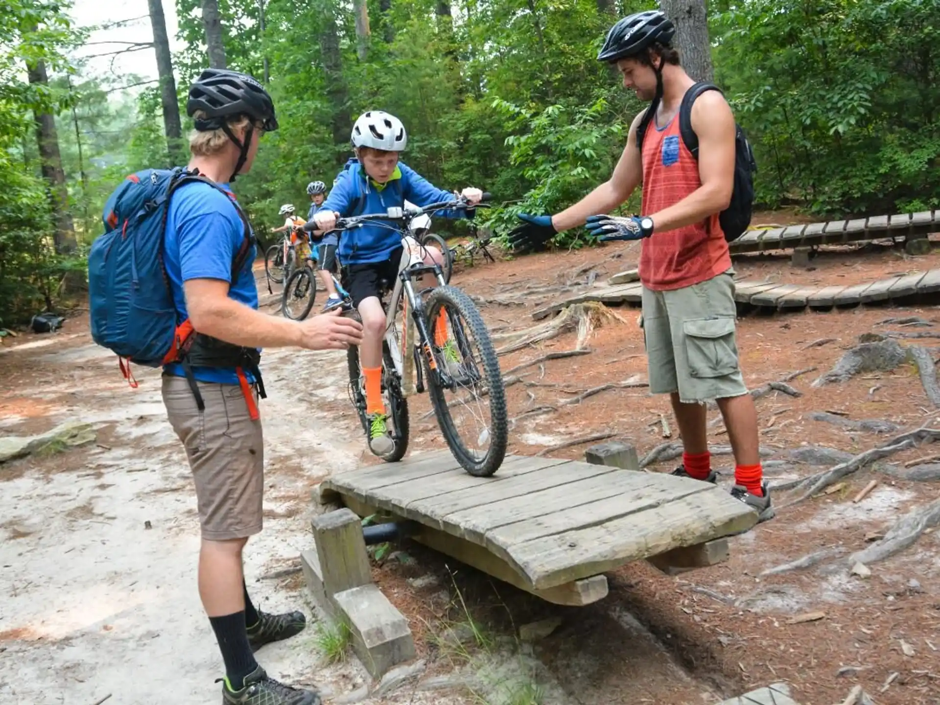 a group of people with bicycles