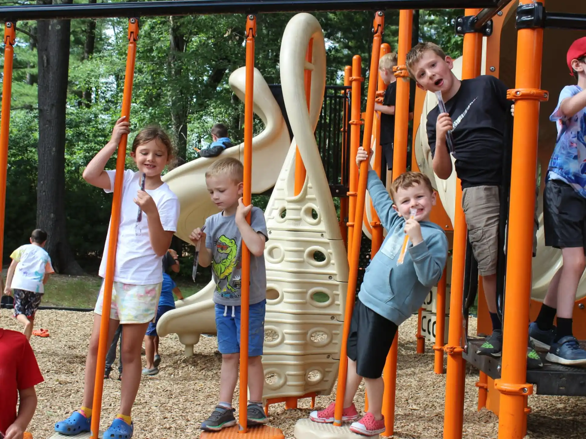 a group of kids playing on a playground