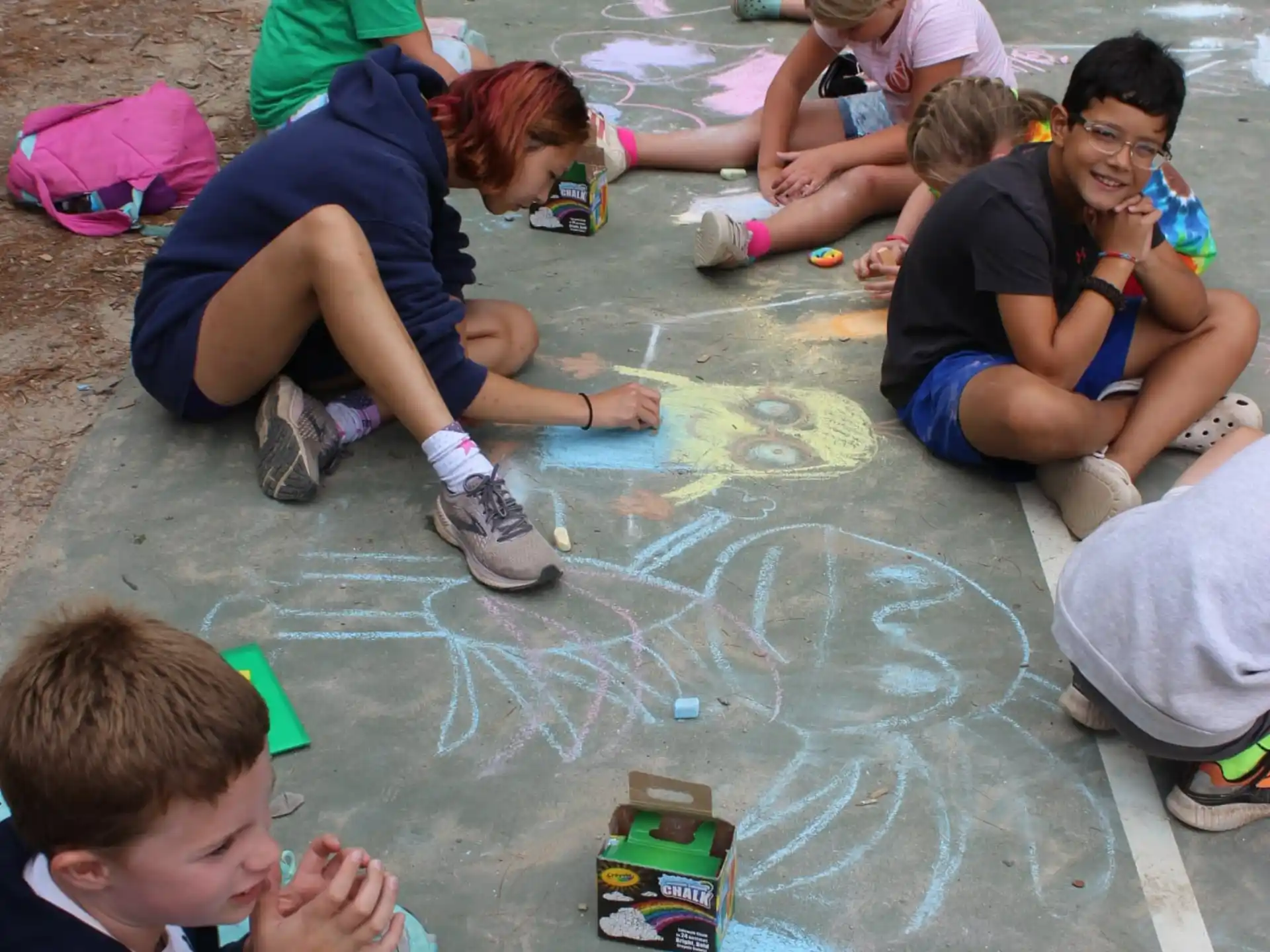 a group of people sitting on the ground