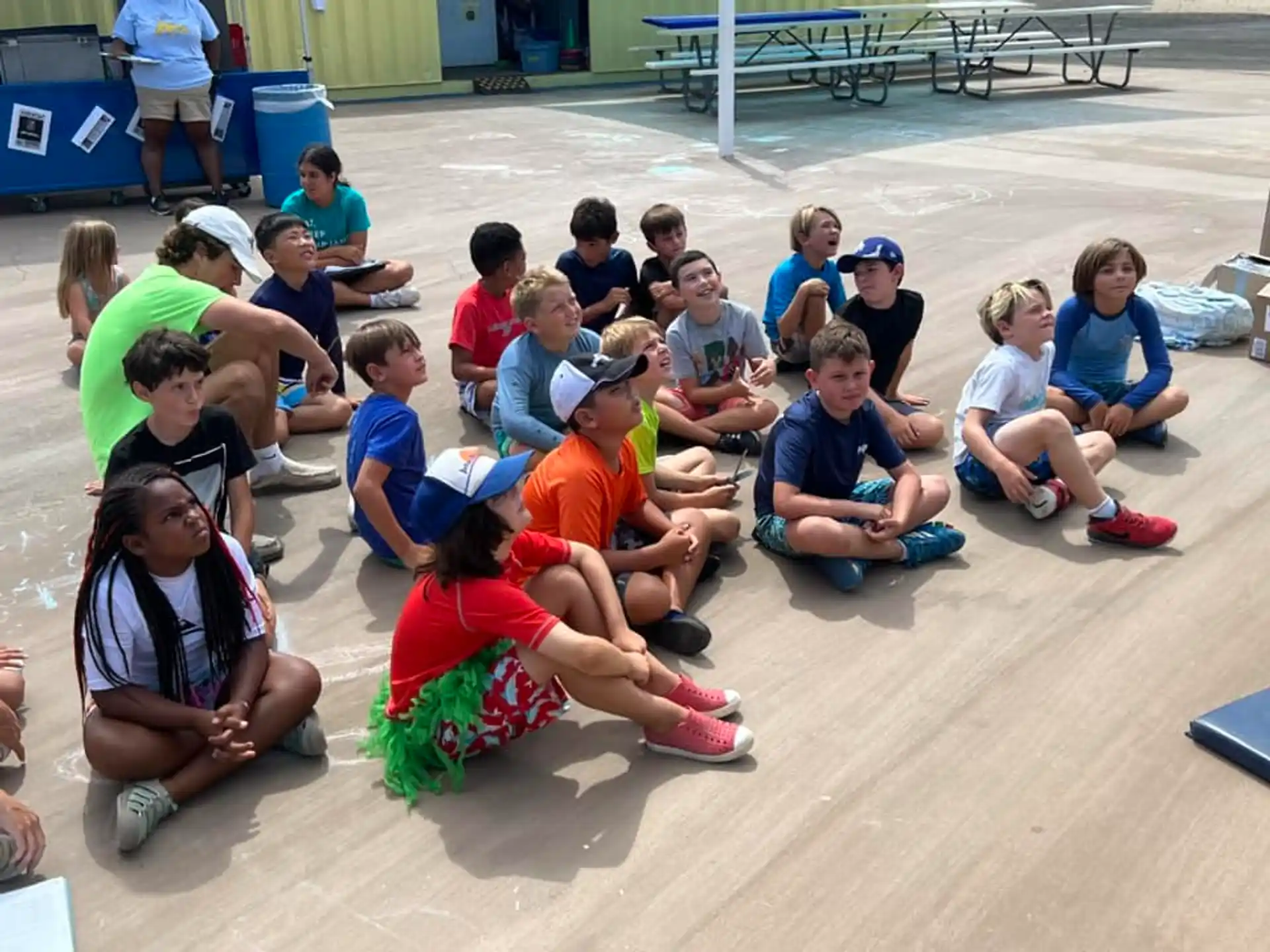 a group of people sitting on the ground