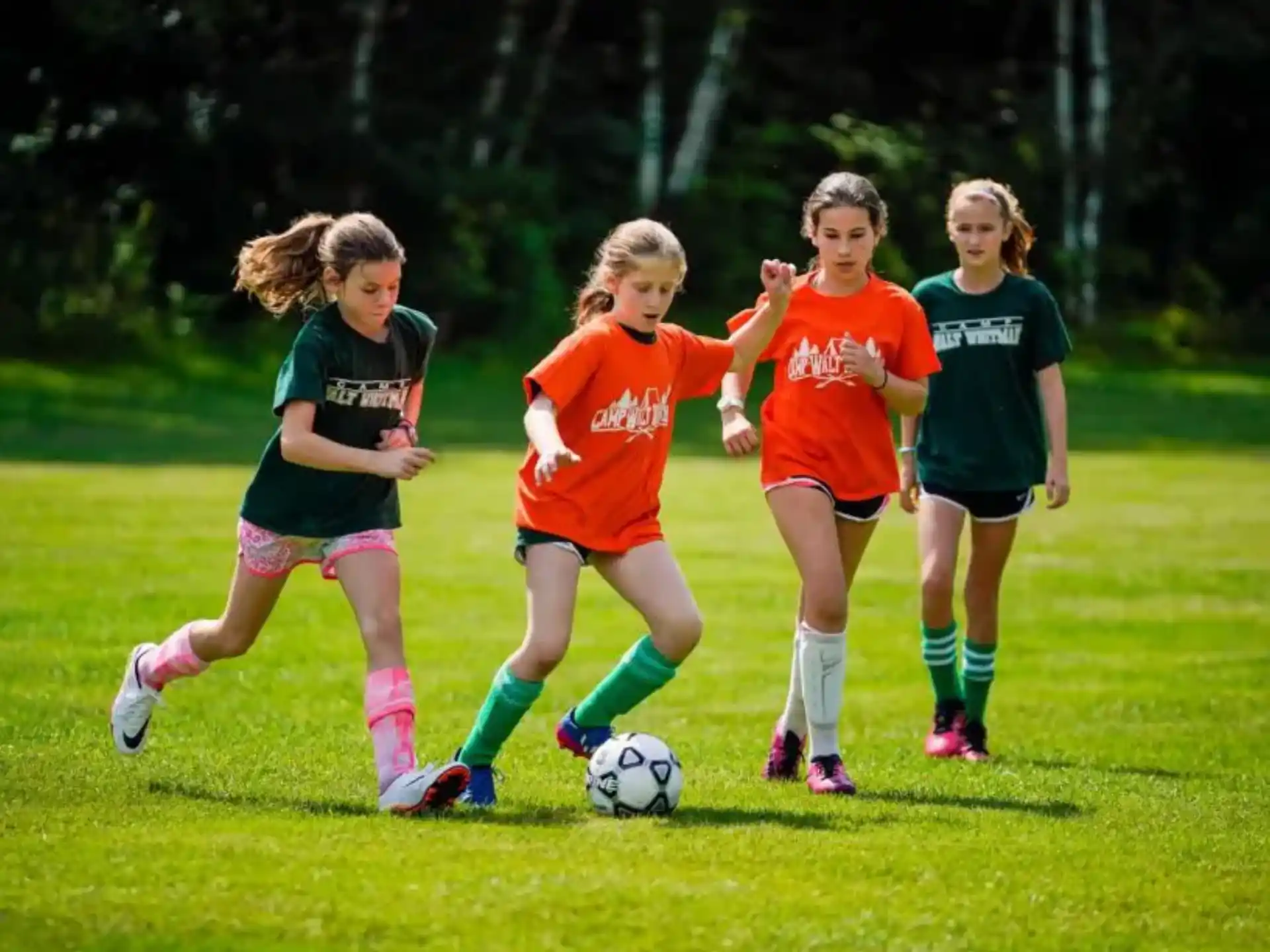 a group of girls playing football