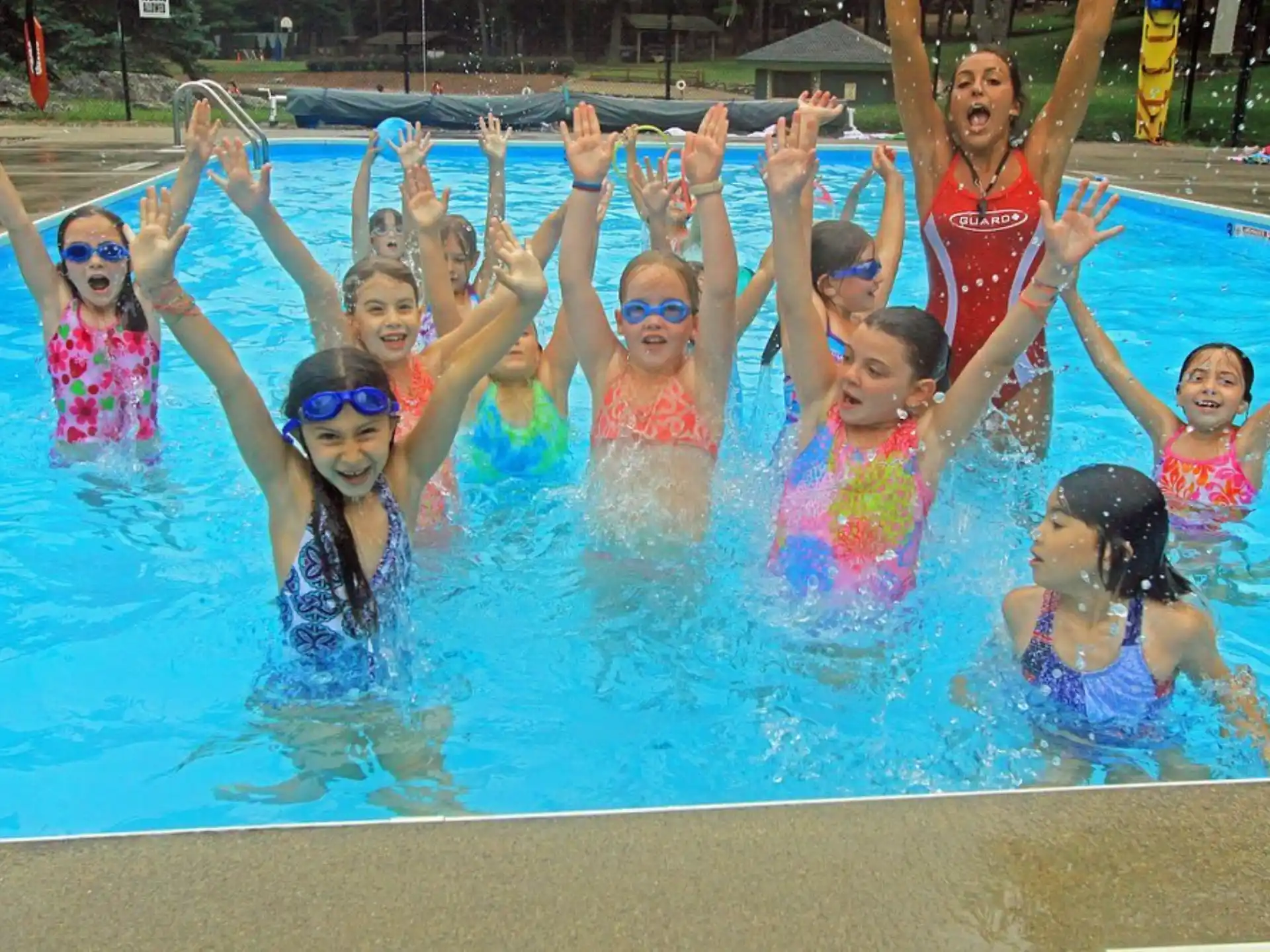 a group of children in a pool