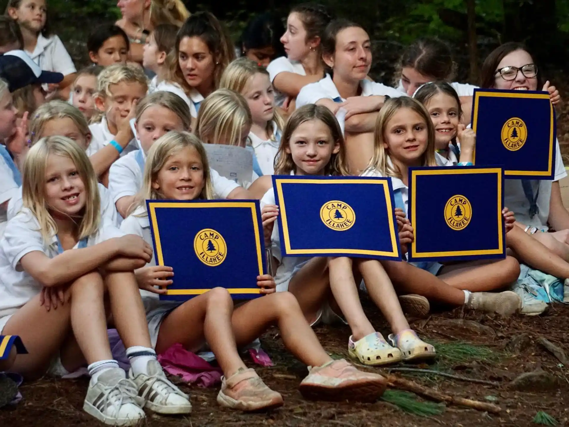 a group of children holding books