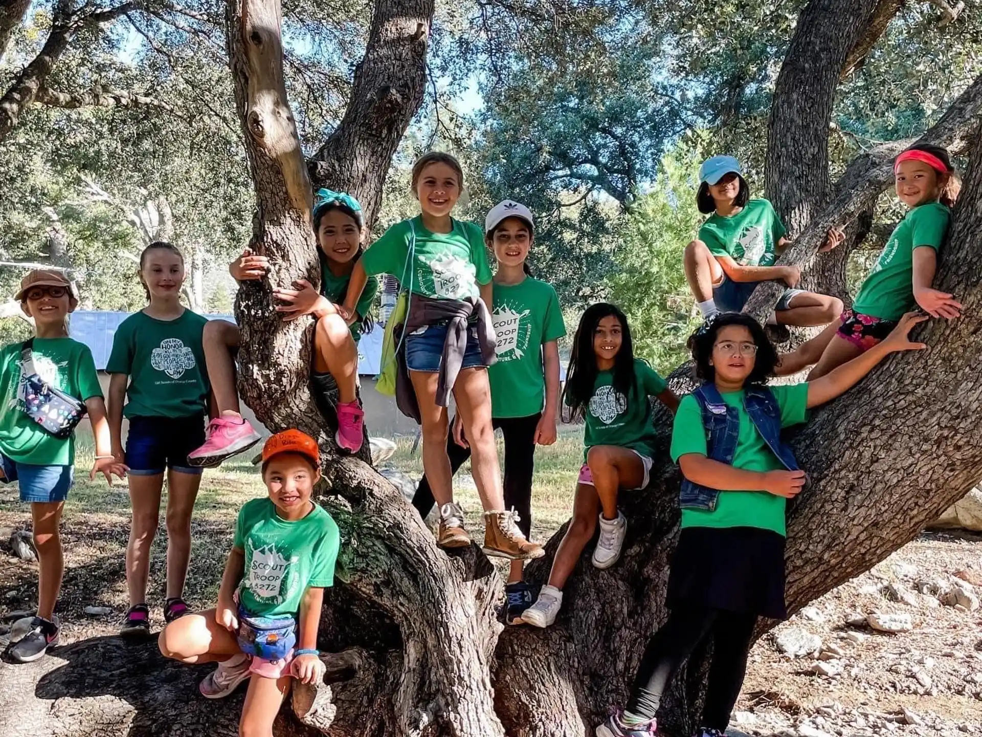 a group of people posing for a photo in the woods