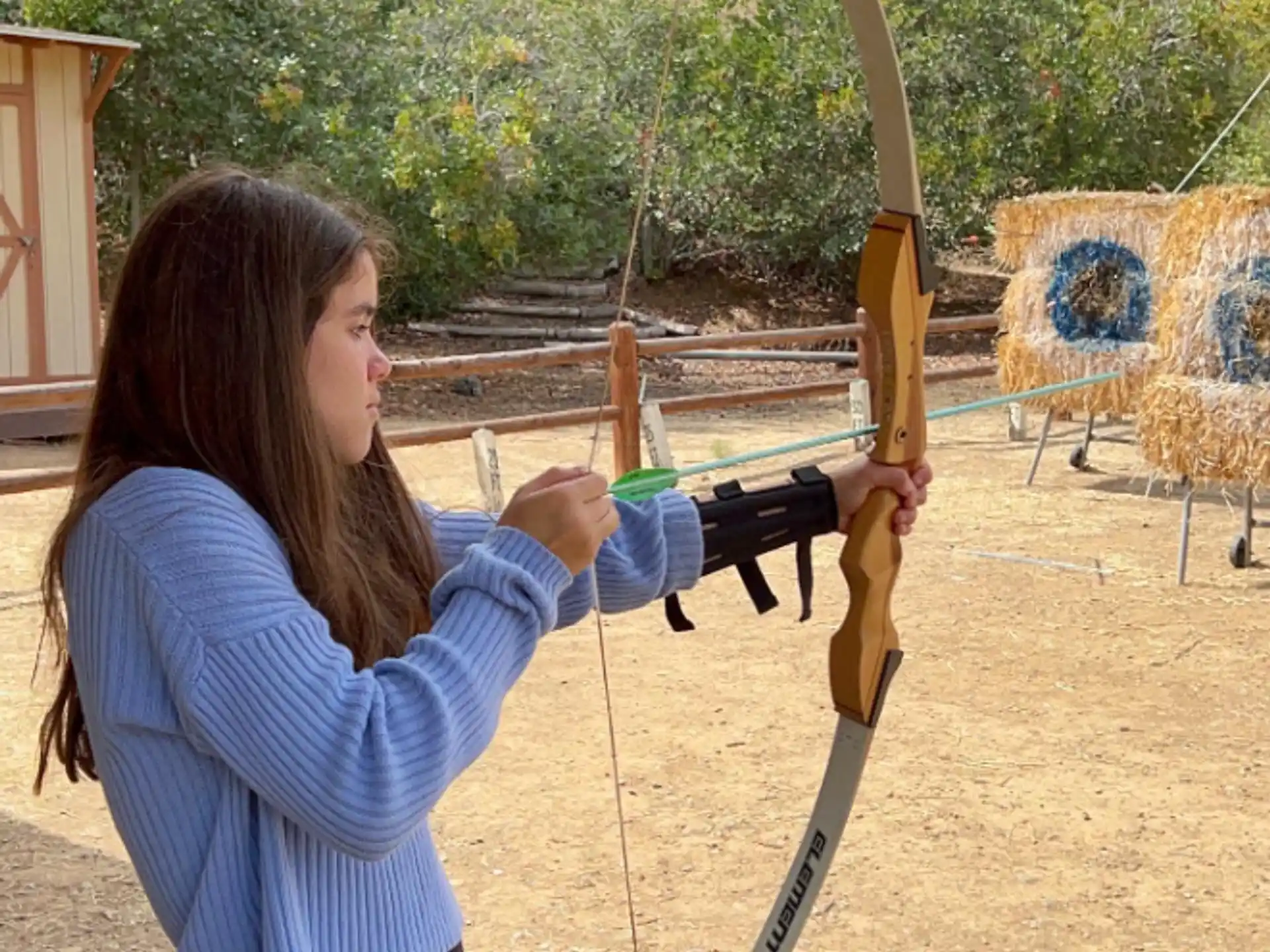 a person holding a bow and arrow