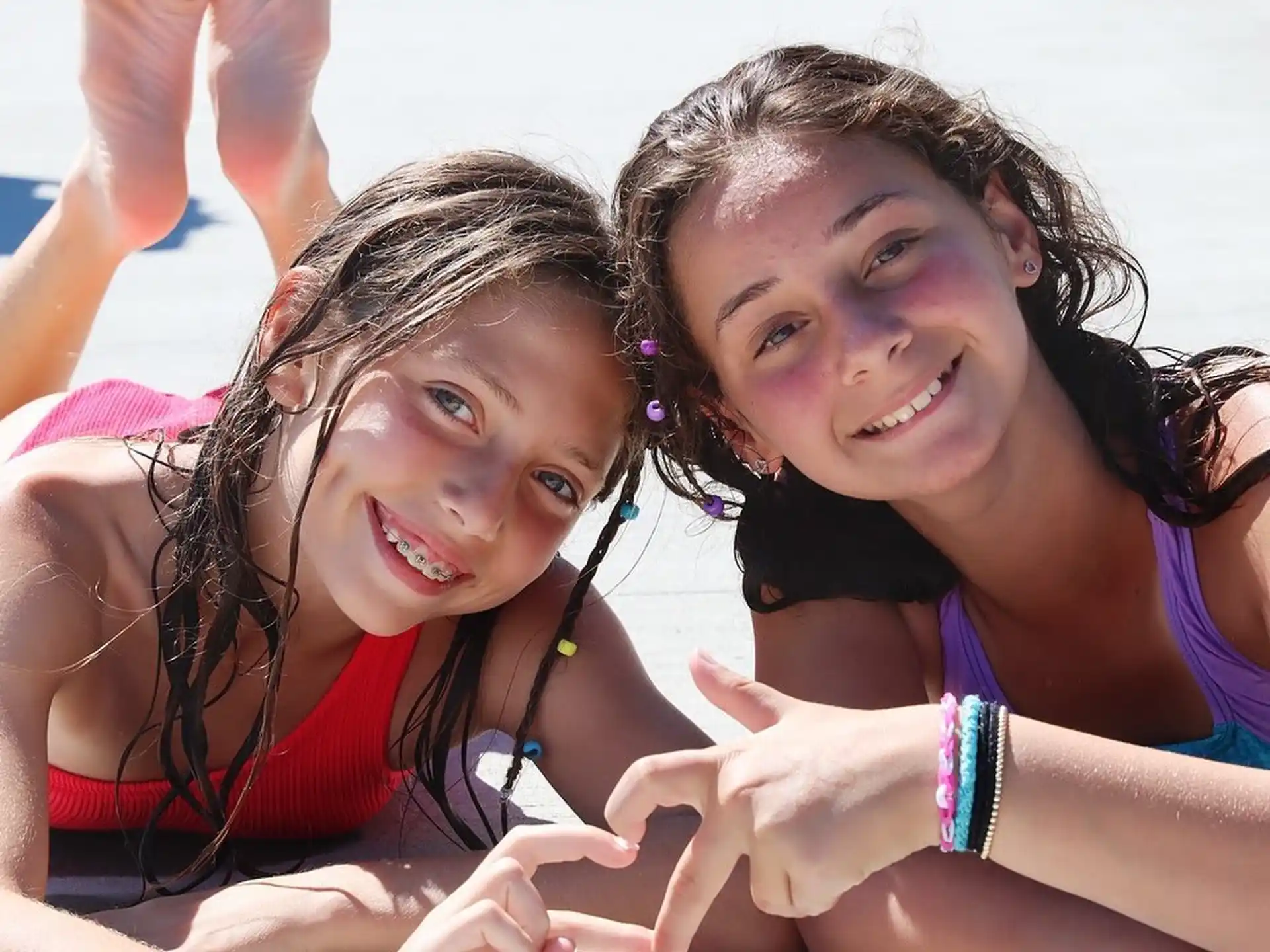 a couple of girls posing for the camera