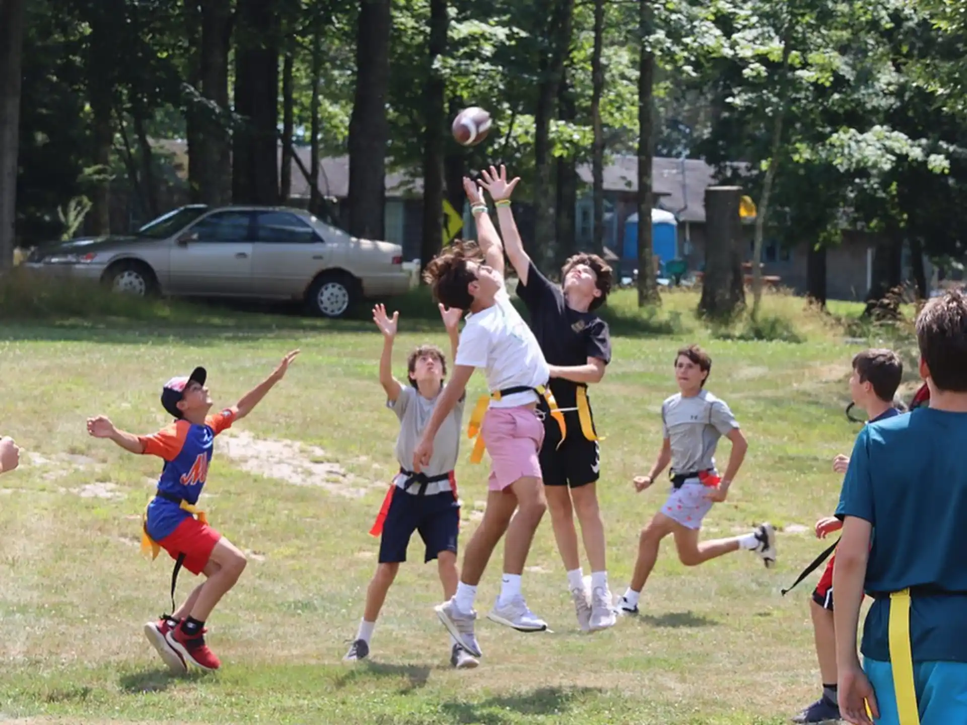 a group of kids playing with a ball