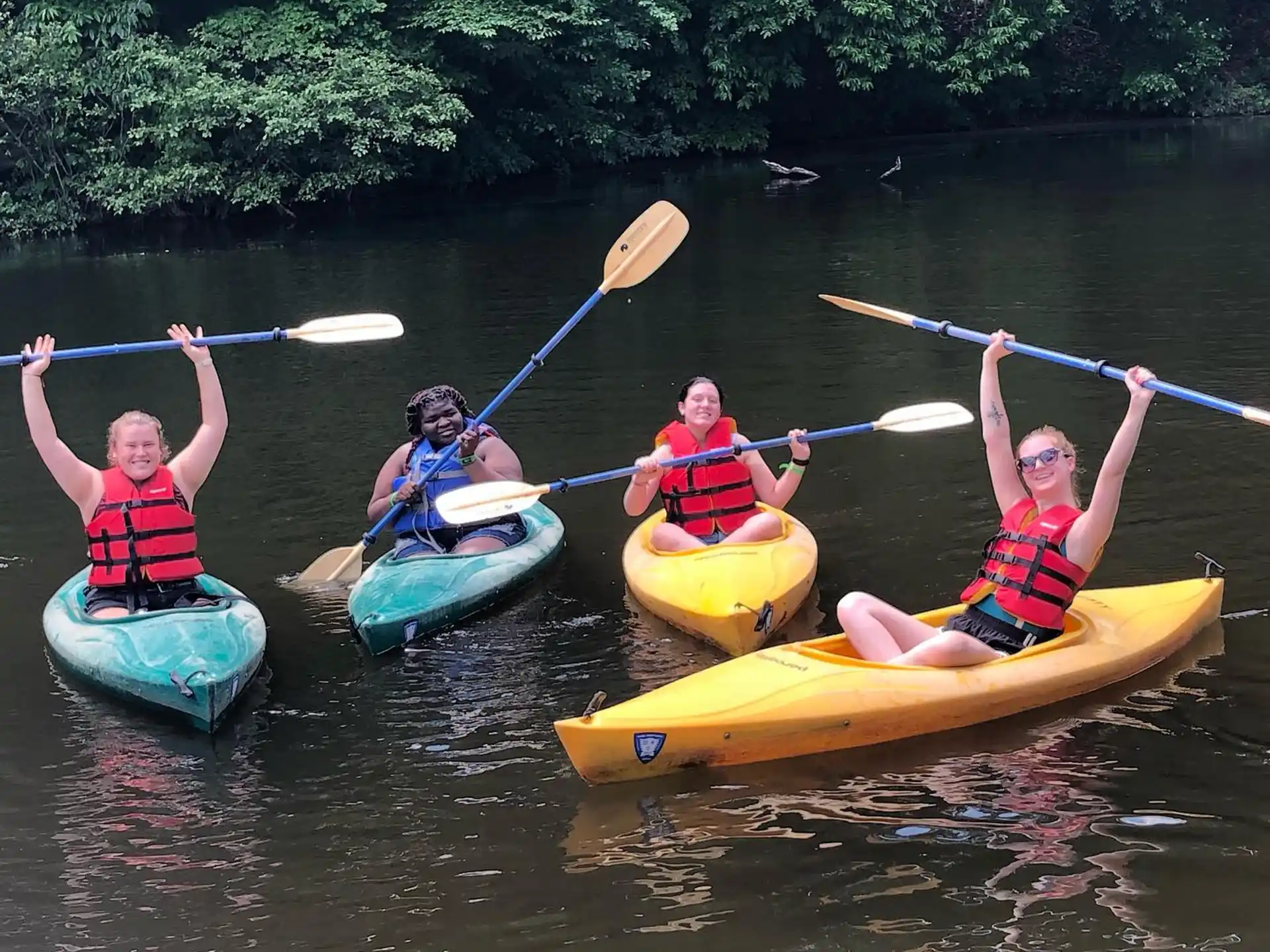 a group of people in kayaks