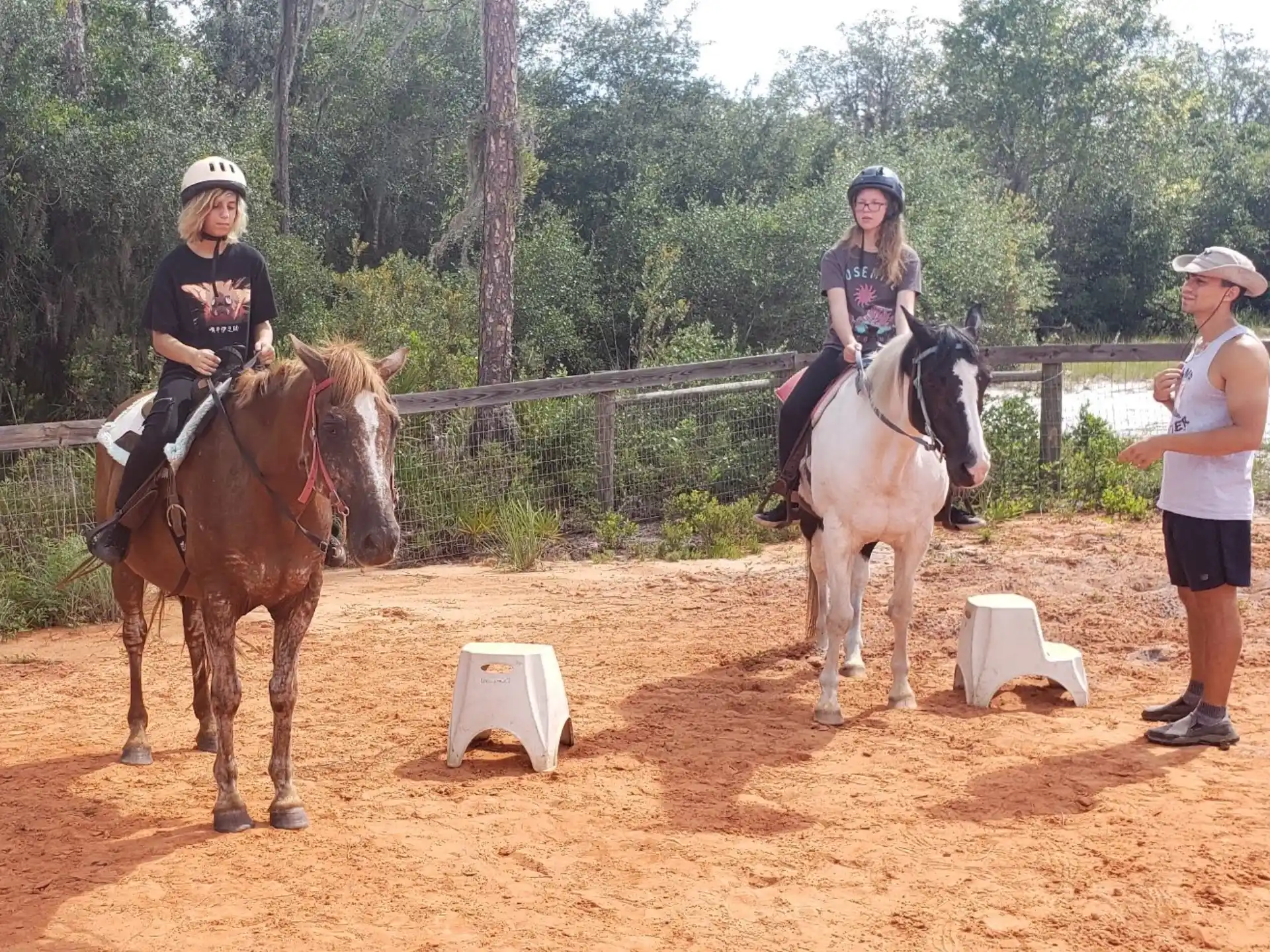a group of people riding horses