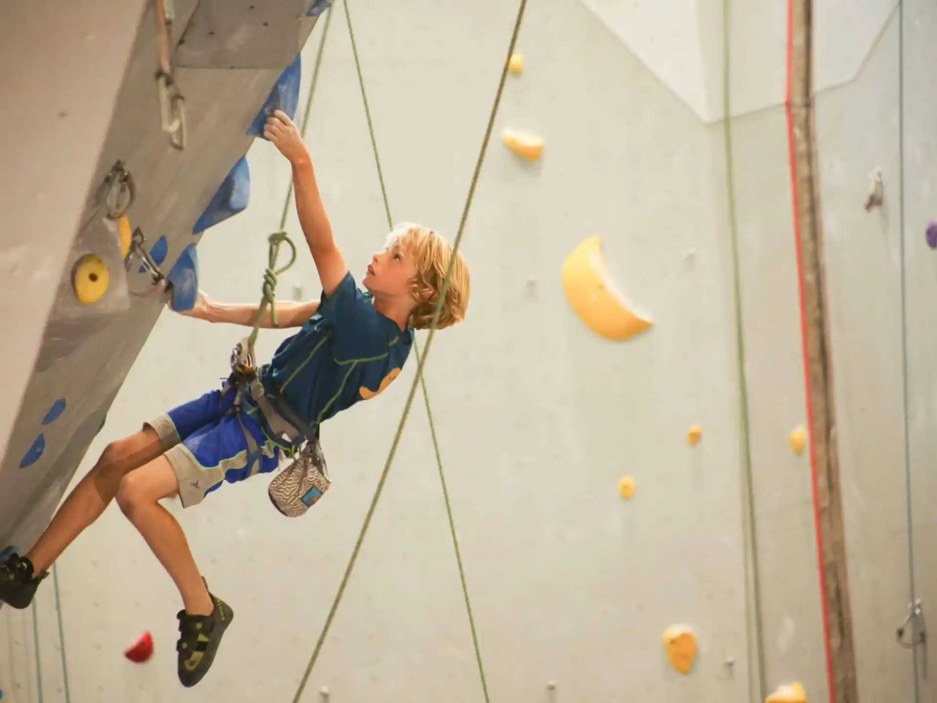 a person climbing a rock wall