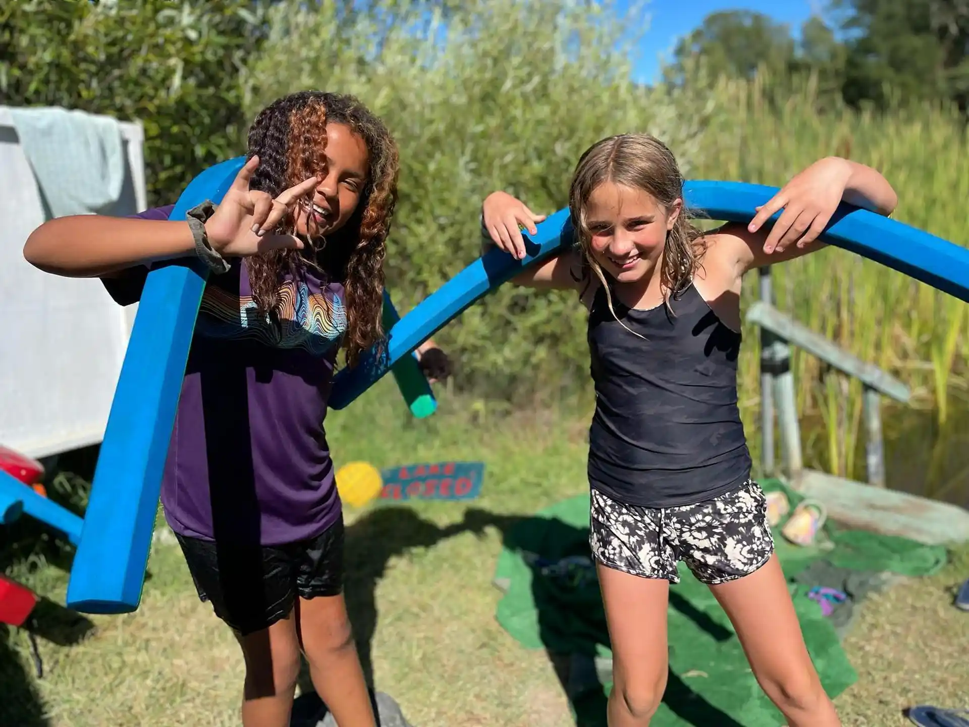 a couple of girls playing on a playground
