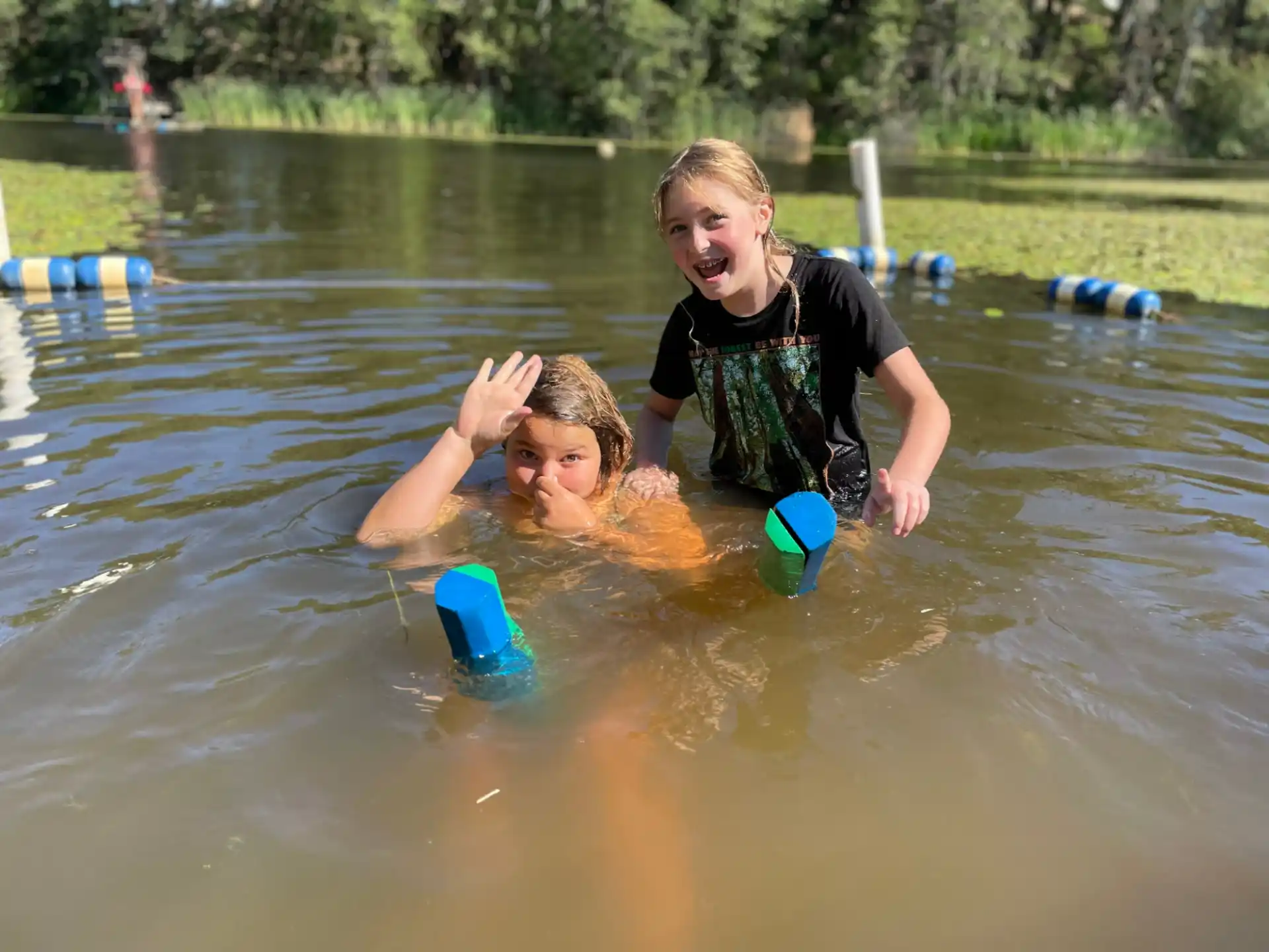 a person and a child in a body of water