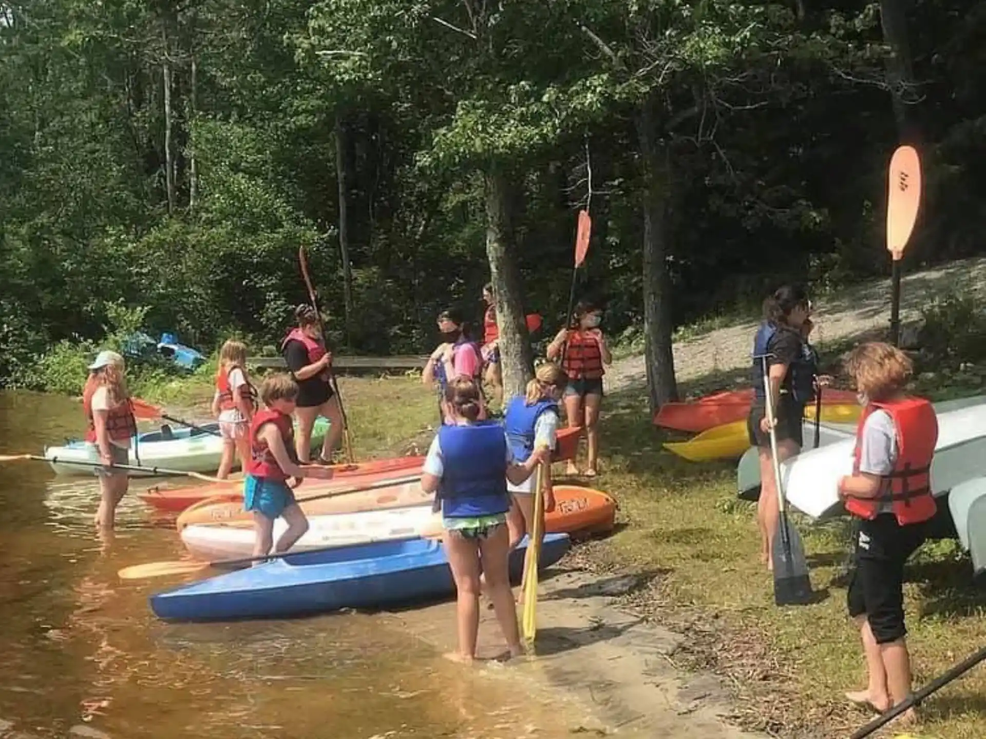 a group of people in a river