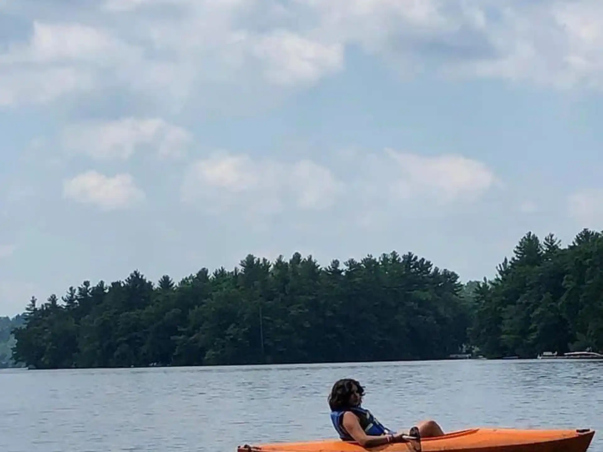 a person in a canoe on a lake