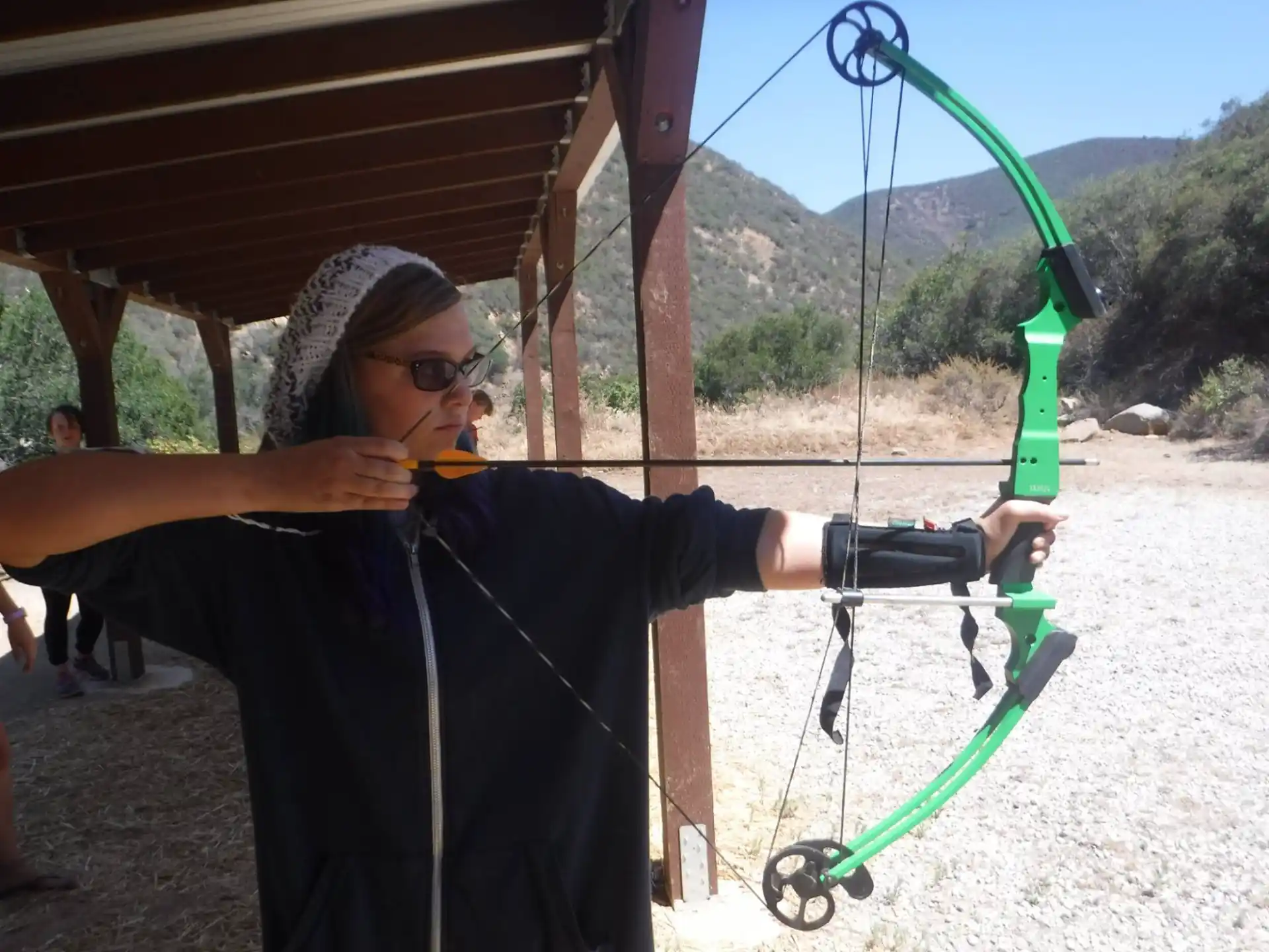 a man holding a bow and arrow