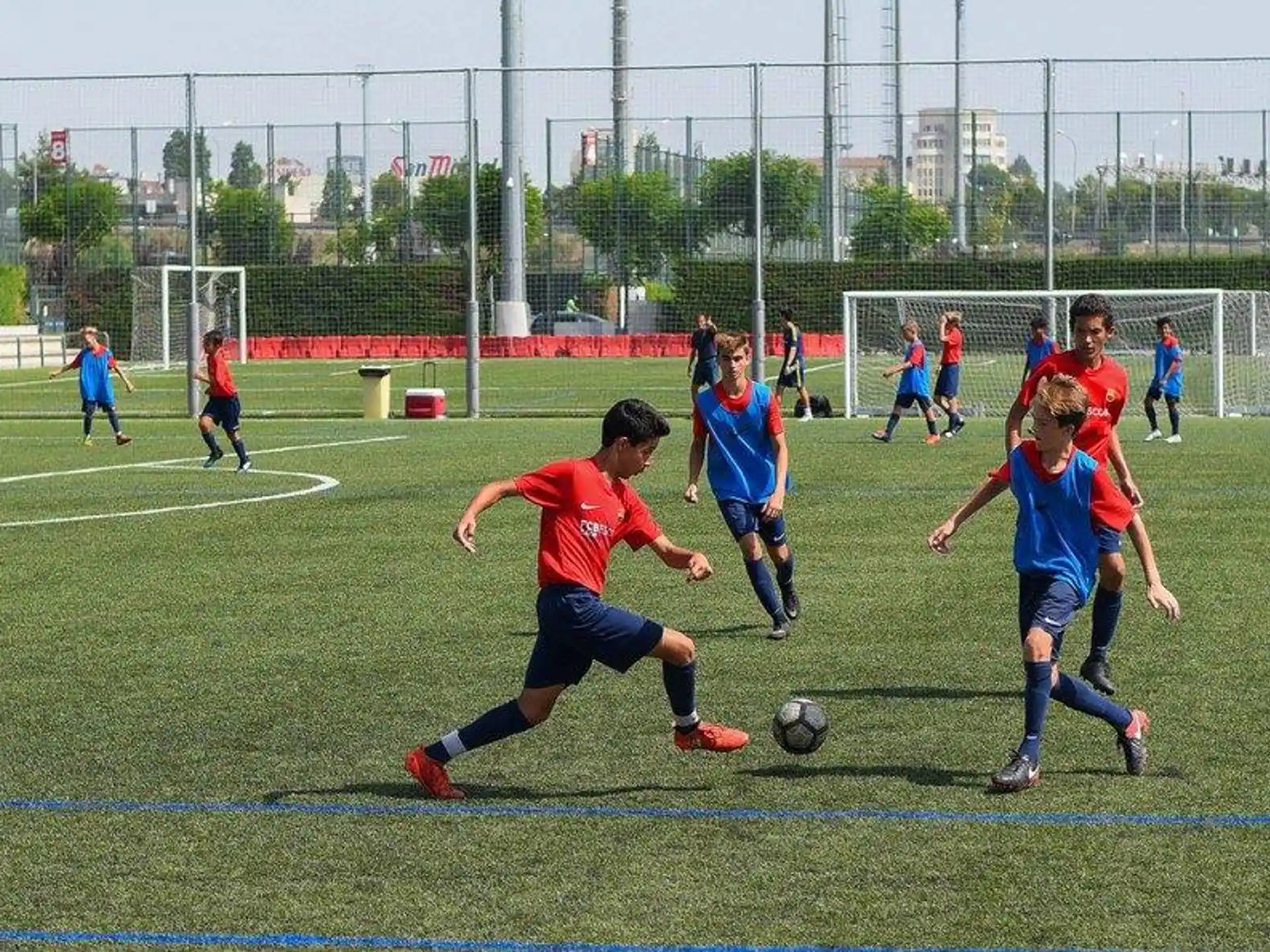a group of kids playing football