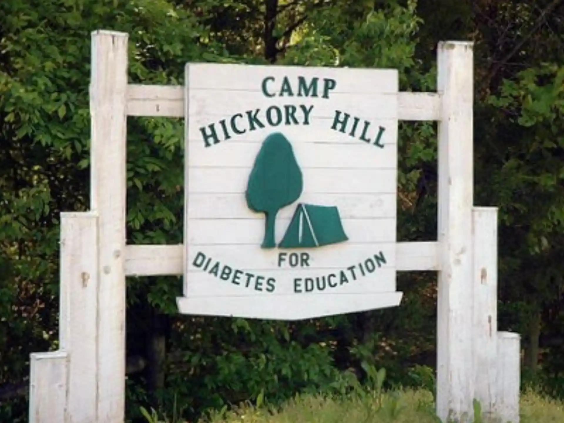 a sign on a wooden fence