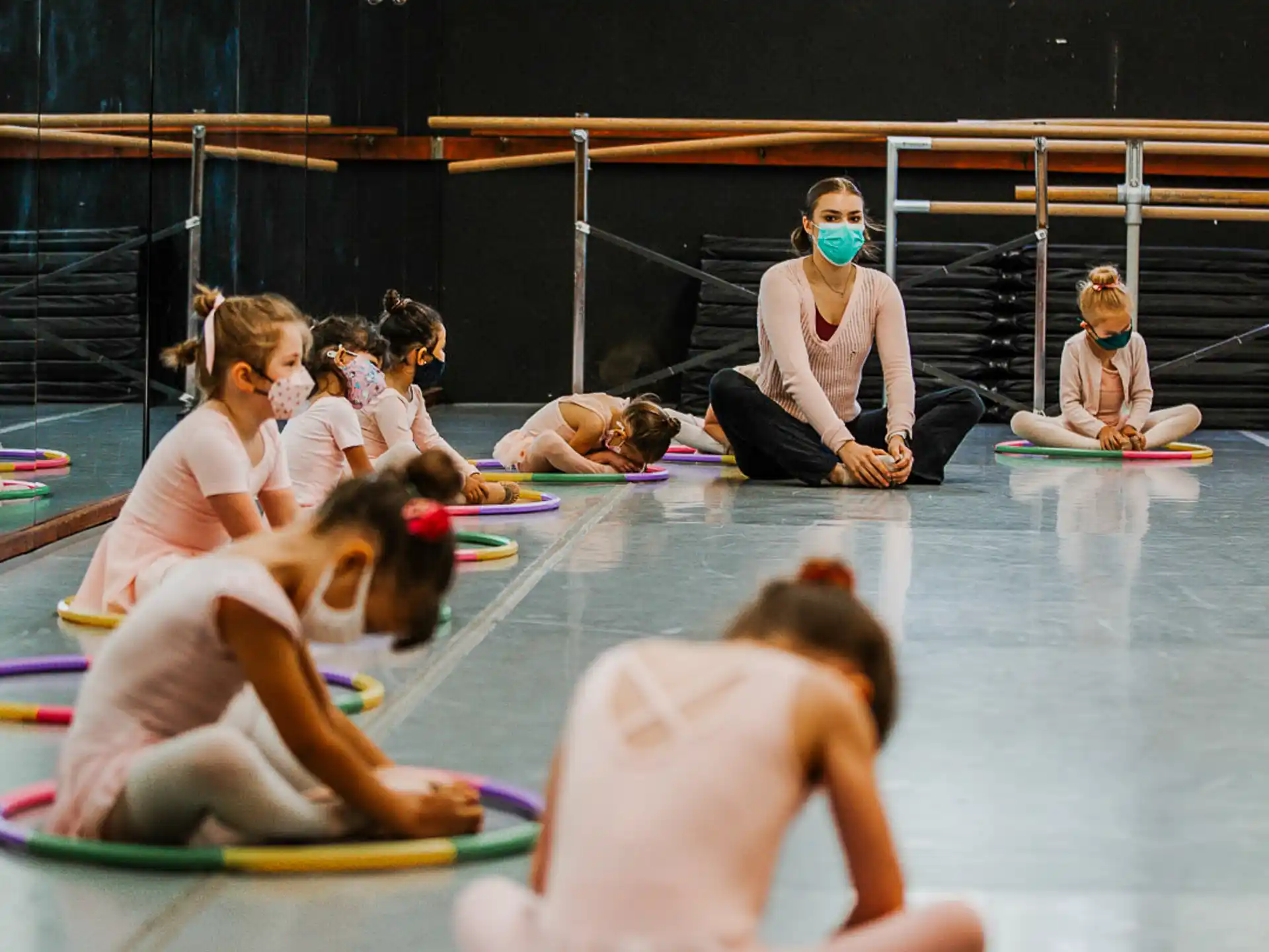 a group of people on mats on a stage