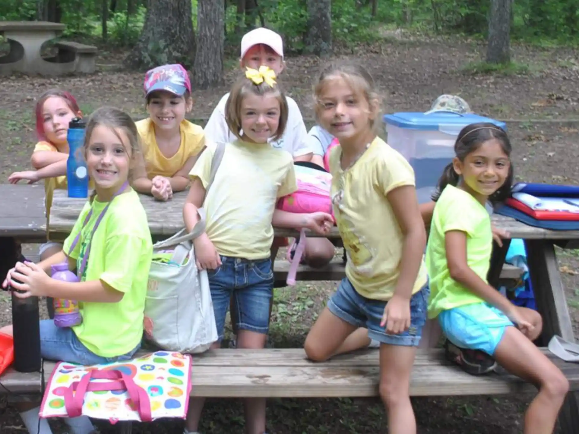 a group of children sitting on a bench