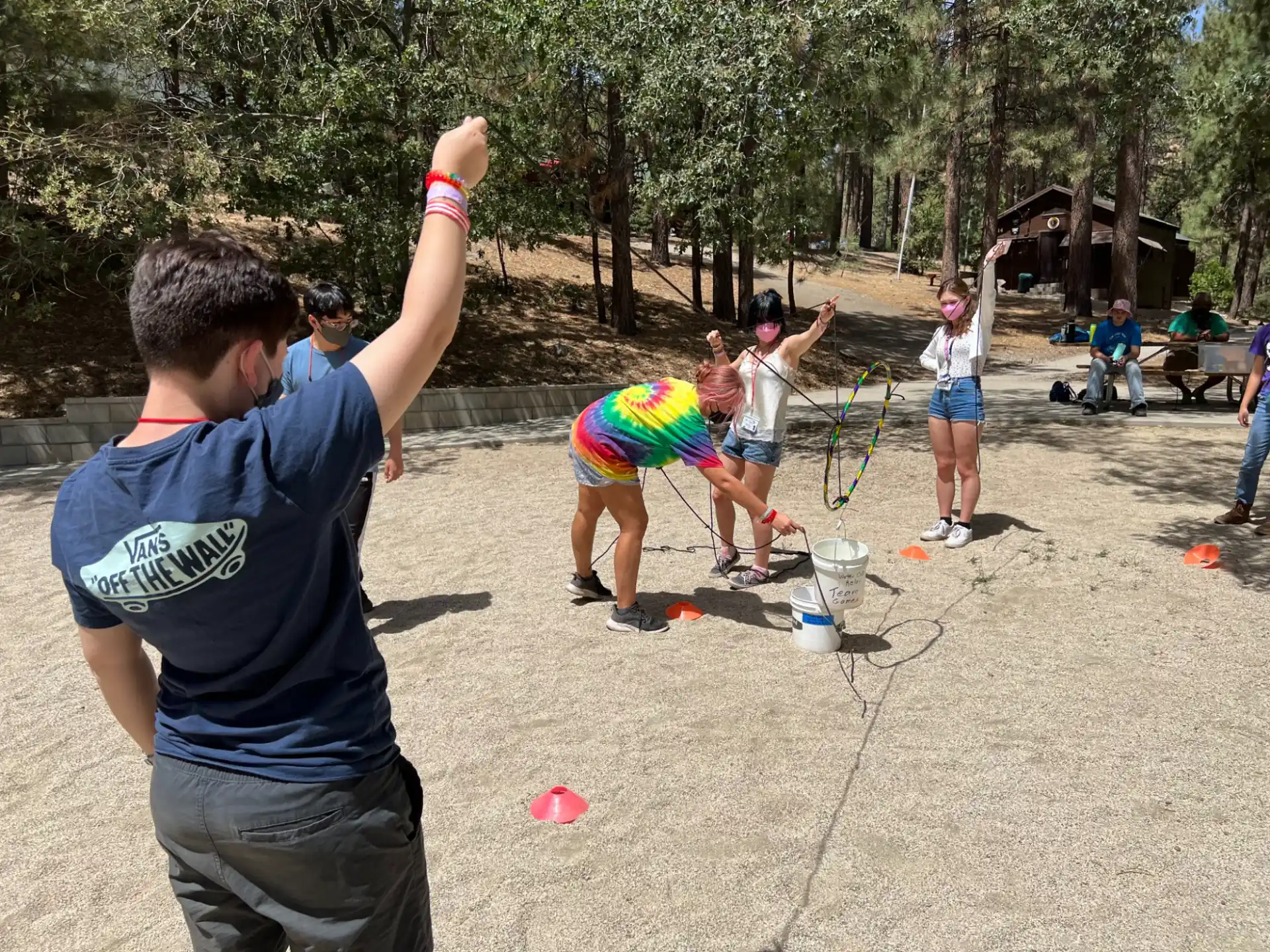 a group of people playing with a kite