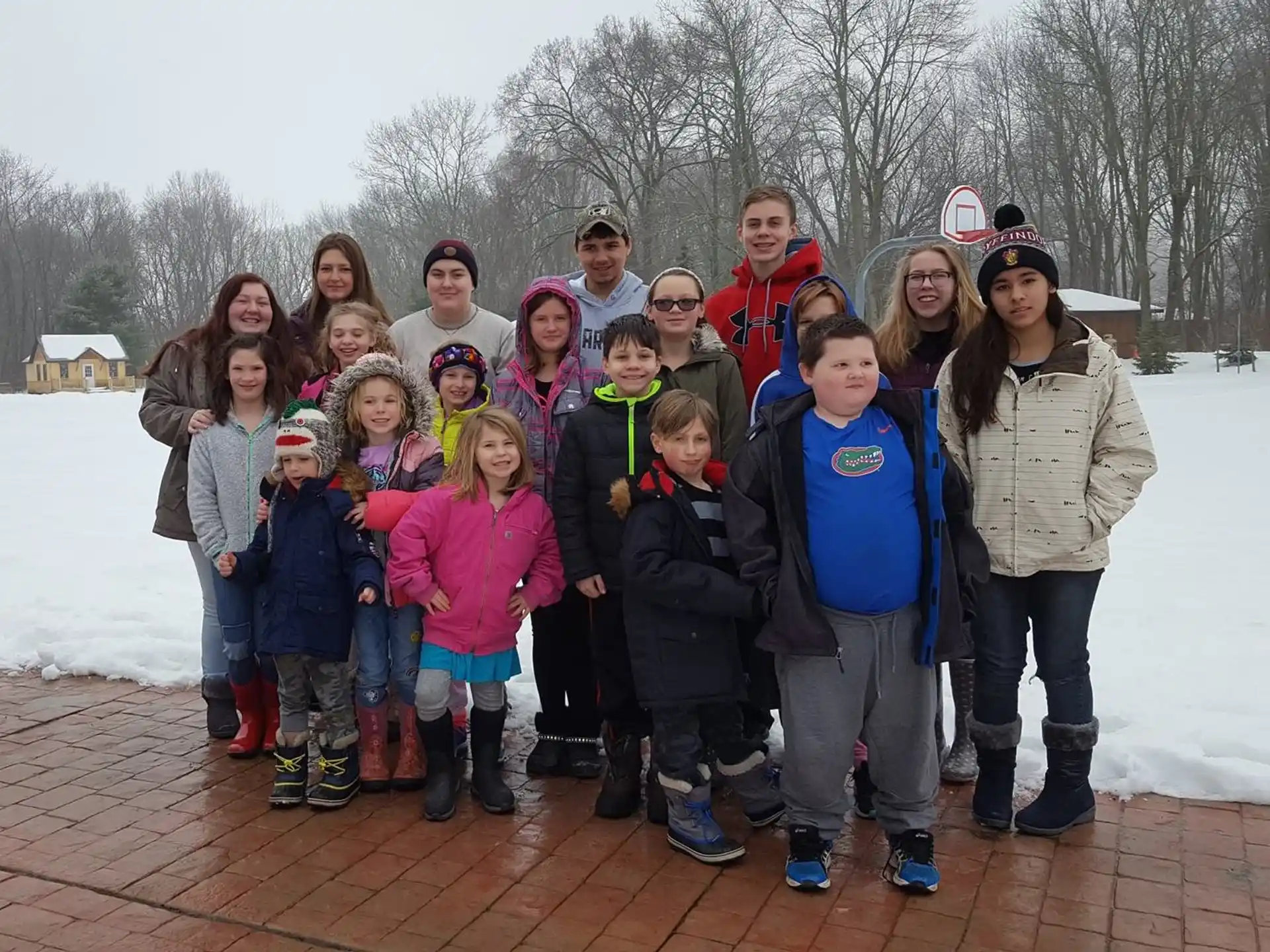 a group of people posing for a photo in the snow