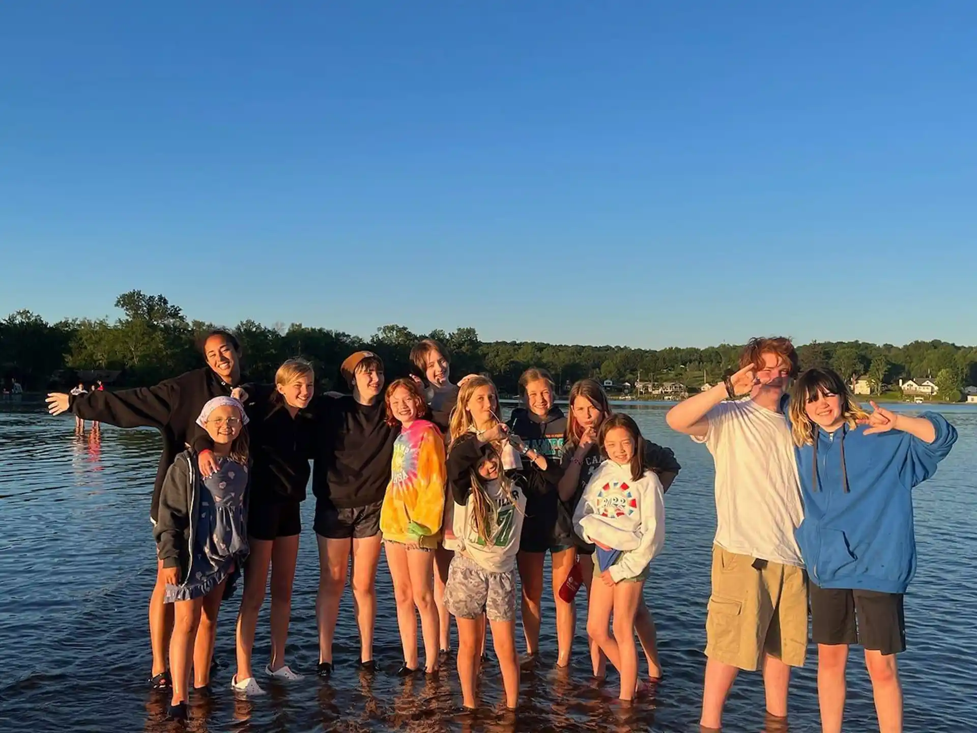 a group of people standing in water
