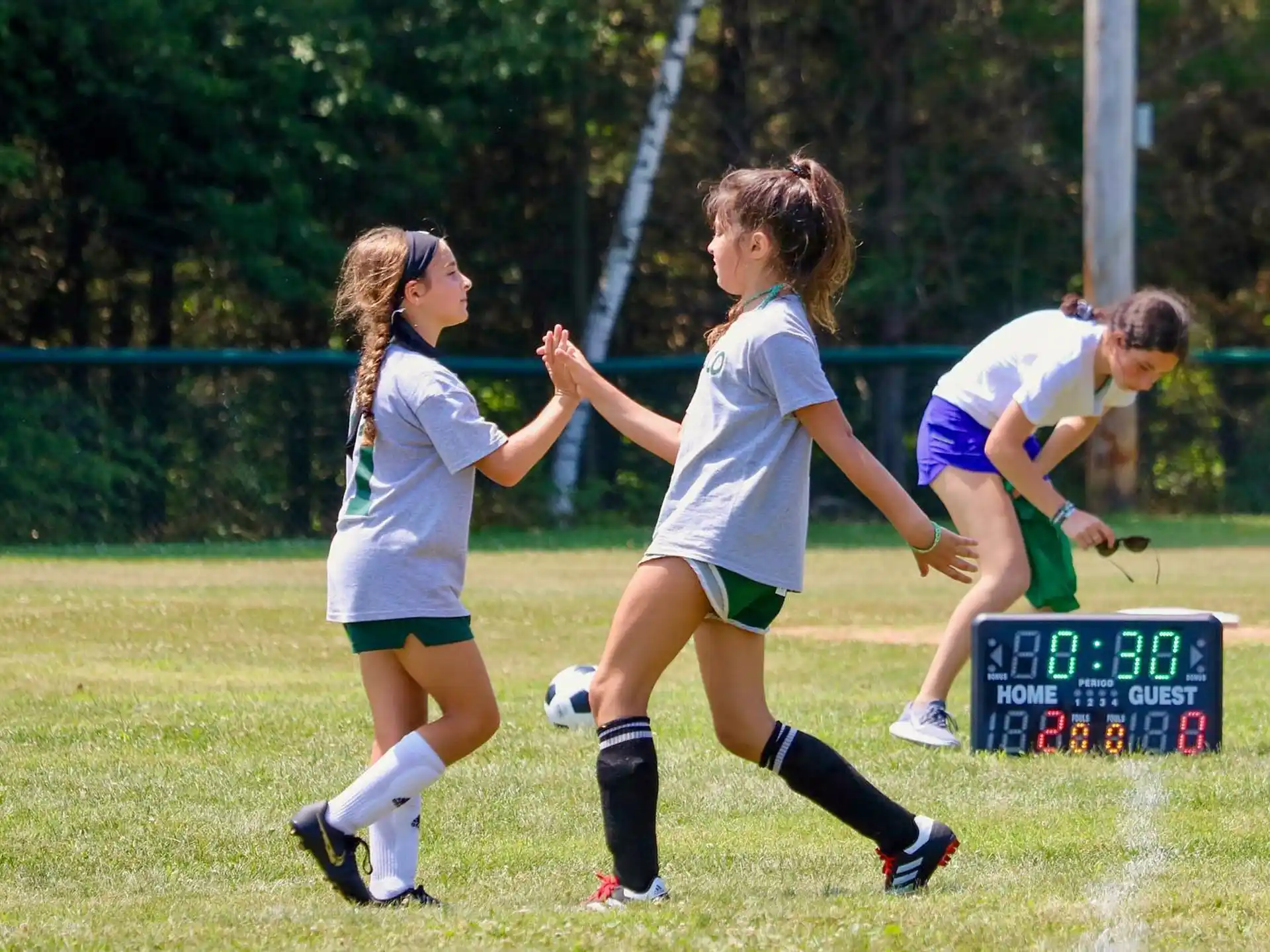a group of girls playing football