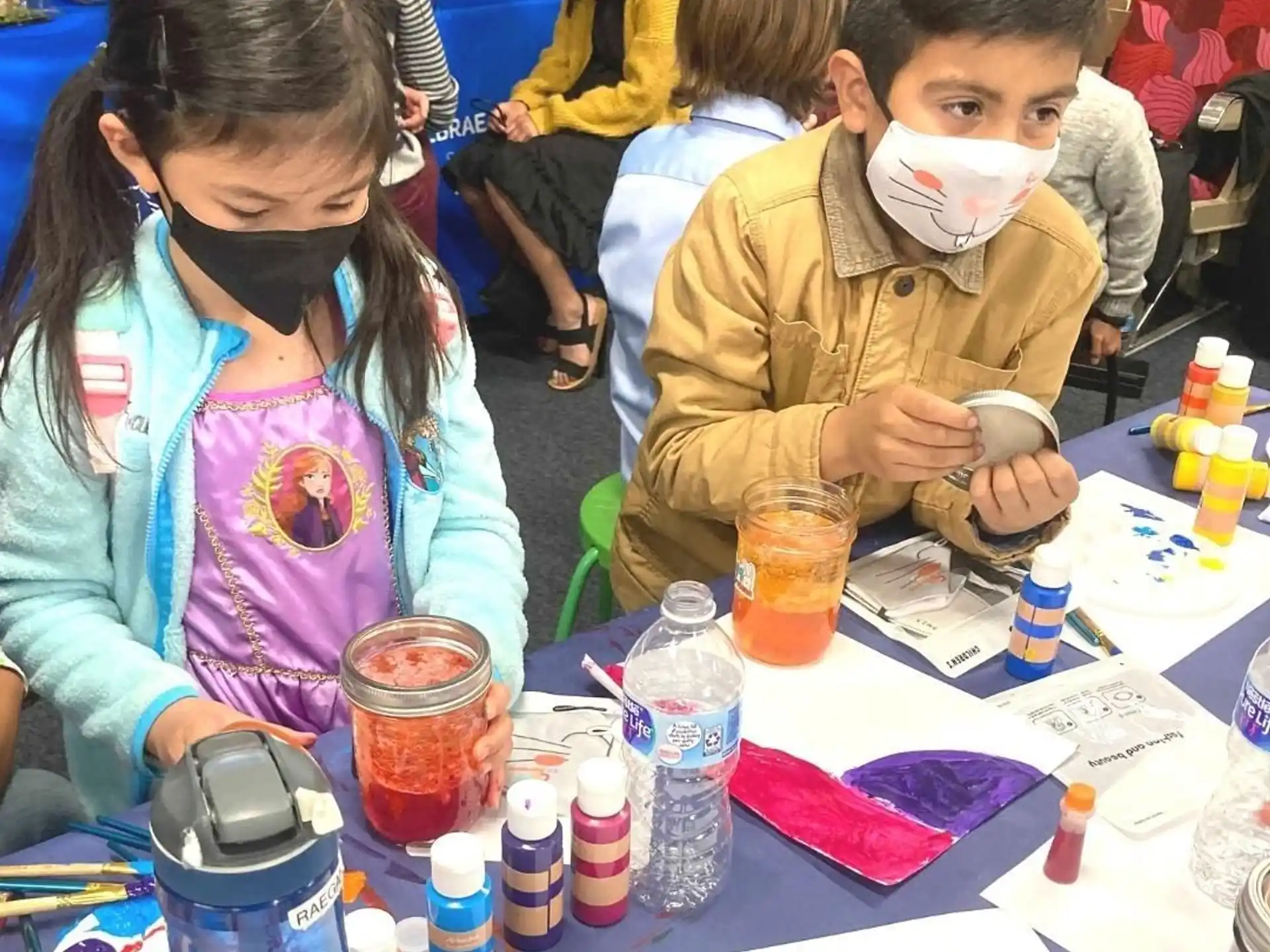 a boy and girl with paint on their faces